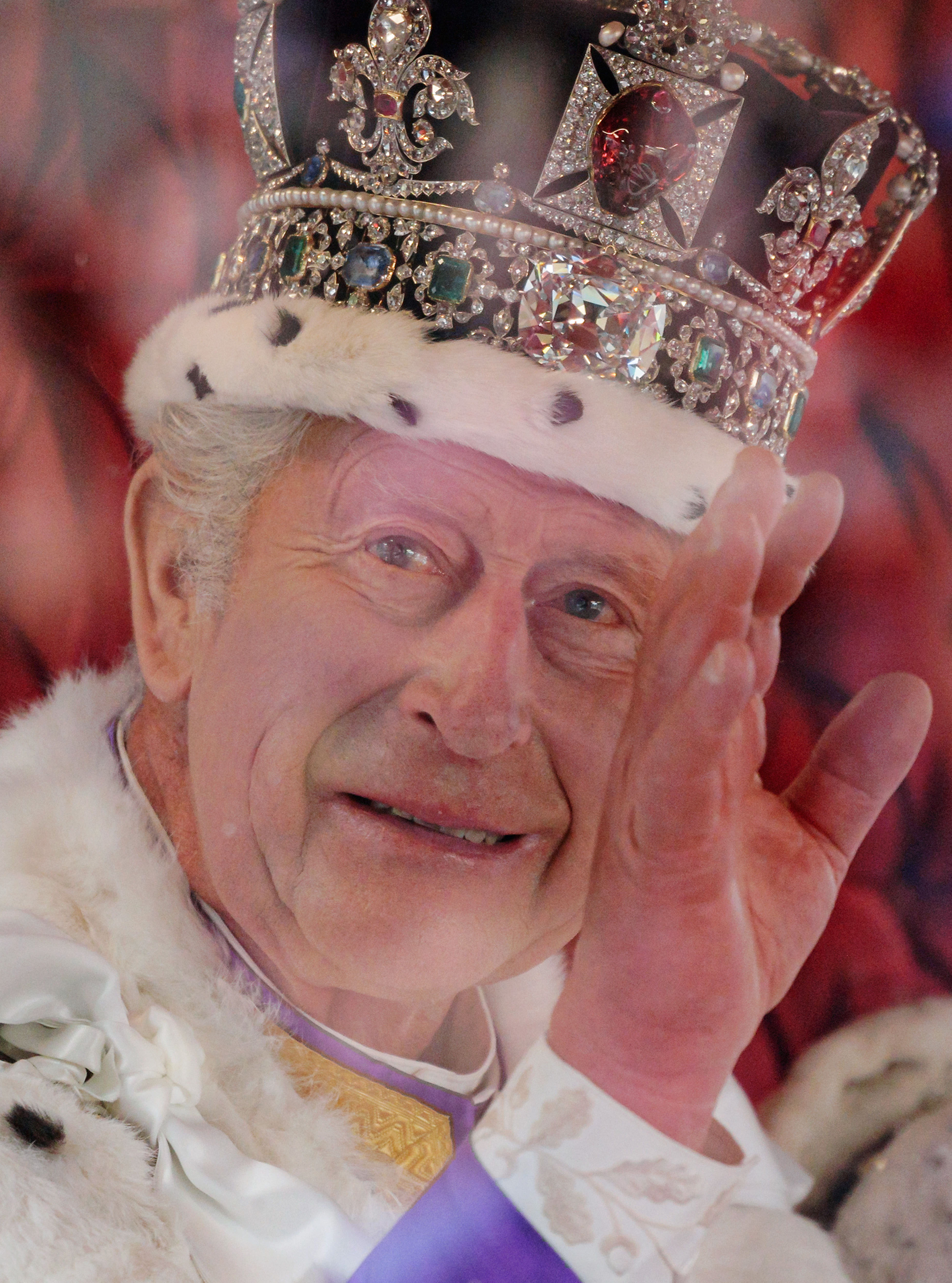 King Charles III waves from The Gold State Coach during the Coronation of King Charles III and Queen Camilla on May 06, 2023 in London, England. | Source: Getty Images