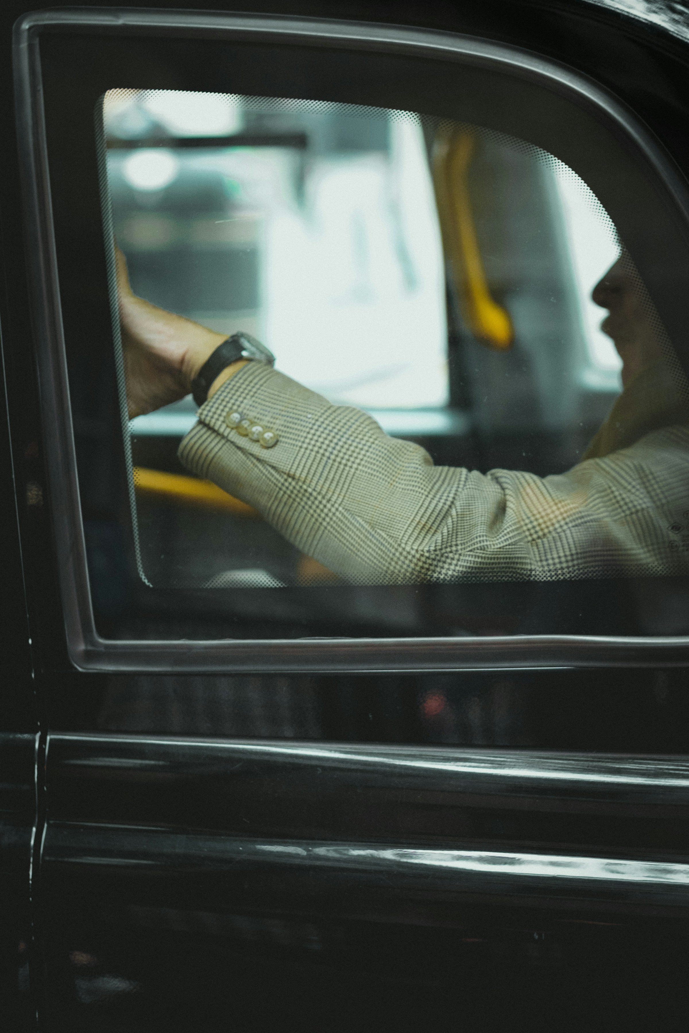 A closeup shot of a man traveling in a cab | Source: Unsplash