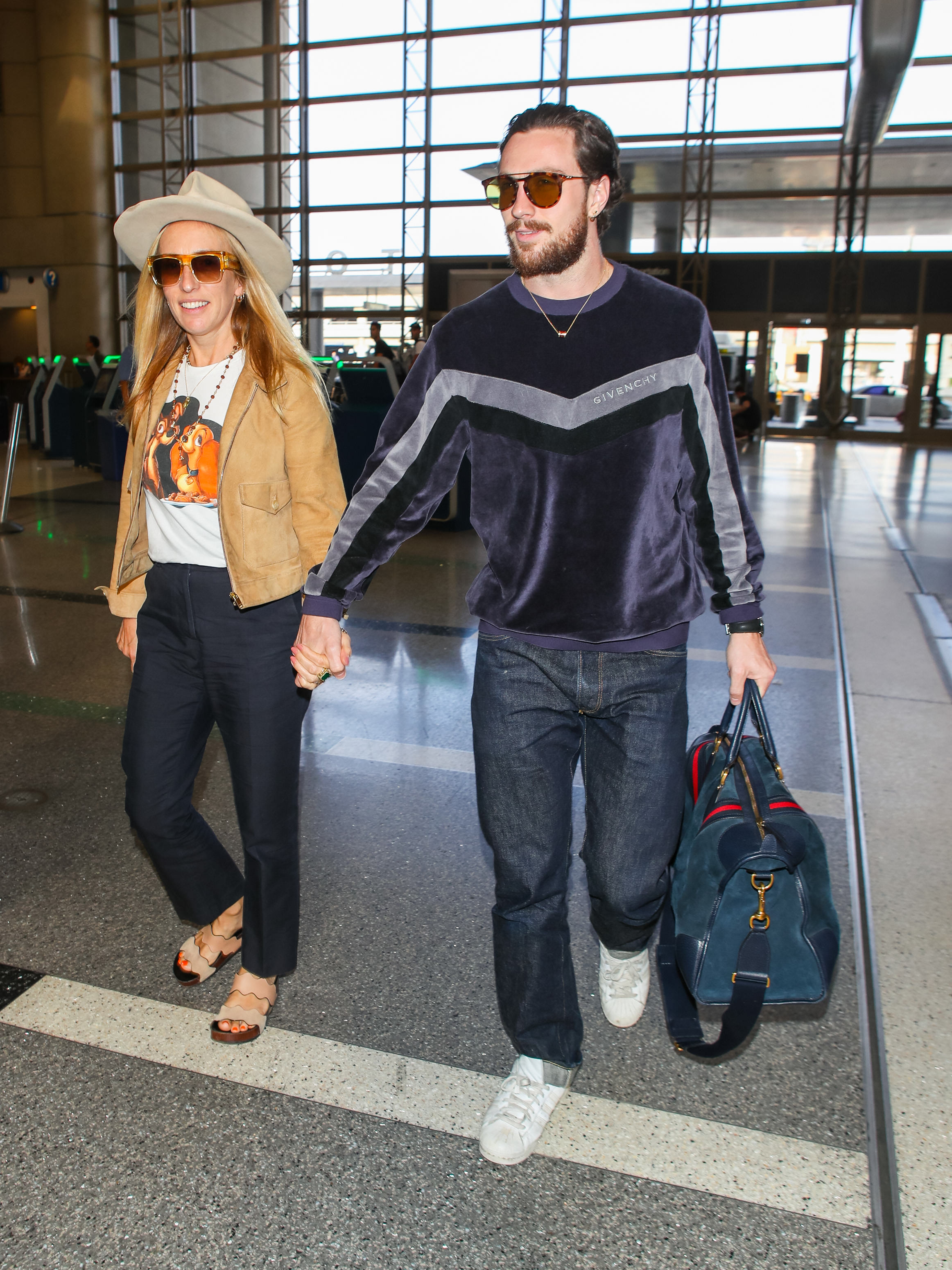 Aaron Taylor-Johnson and Sam Taylor-Johnson at Los Angeles International Airport in 2018 | Source: Getty Images