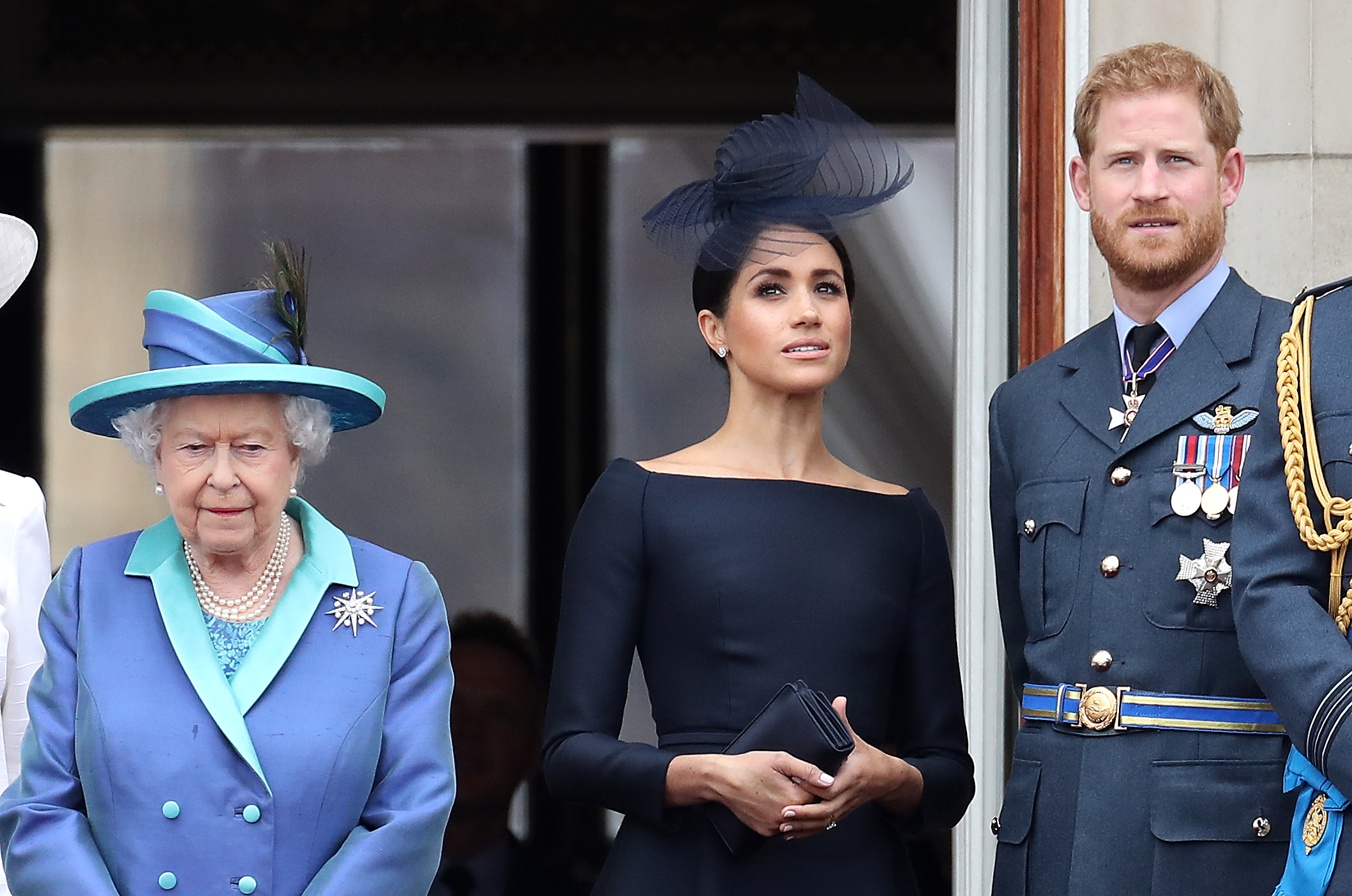 Queen Elizabeth II, Meghan Markle, and Prince Harry at Buckingham Palace as the Royal family attend events to mark the Centenary of the RAF on July 10, 2018 in London, England | Source: Getty Images