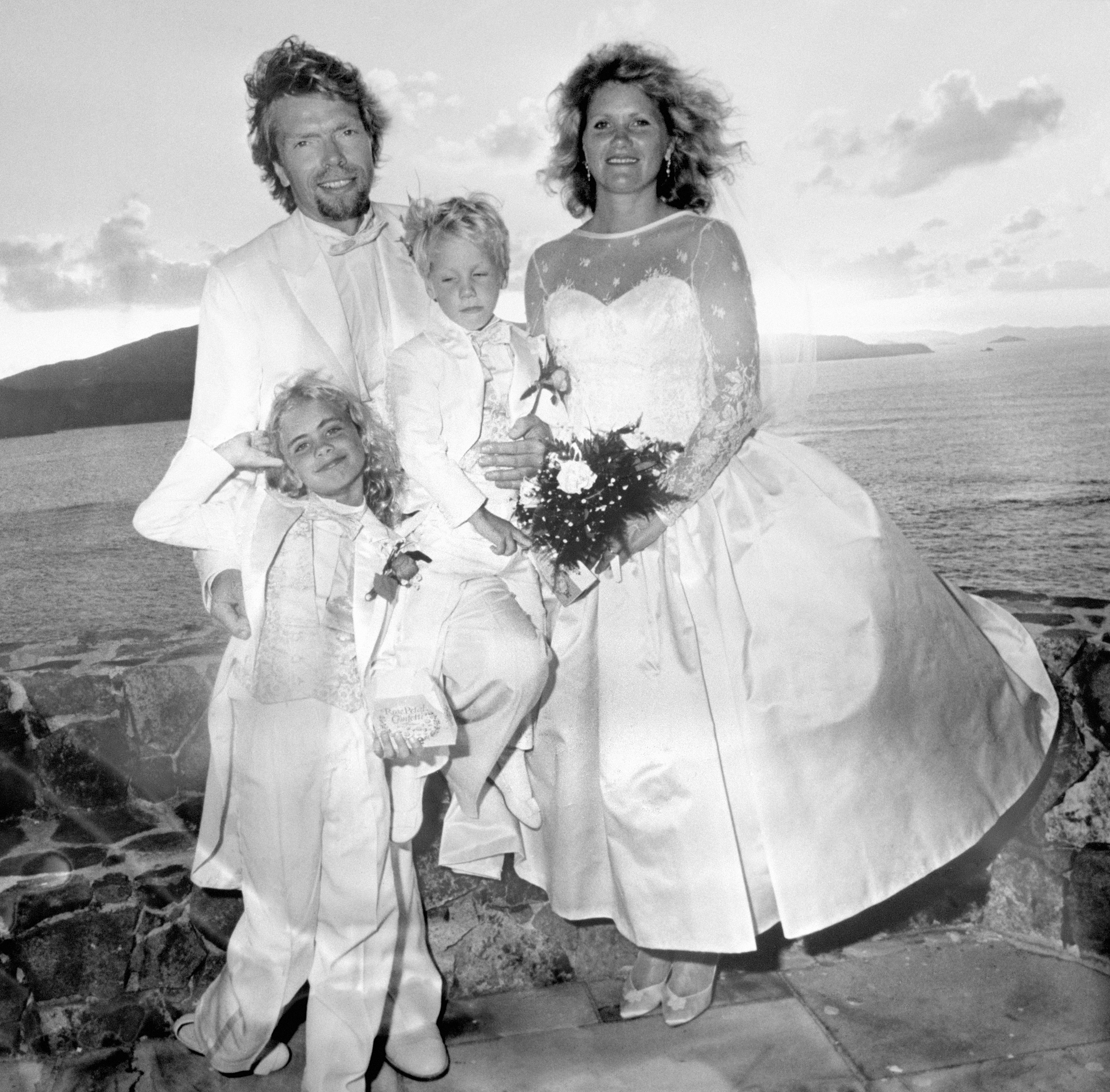 Richard Branson and Joan Templeman, with their children, Holly and Sam, after the couple's wedding on the Caribbean island of Necker in 1989. | Source: Getty Images