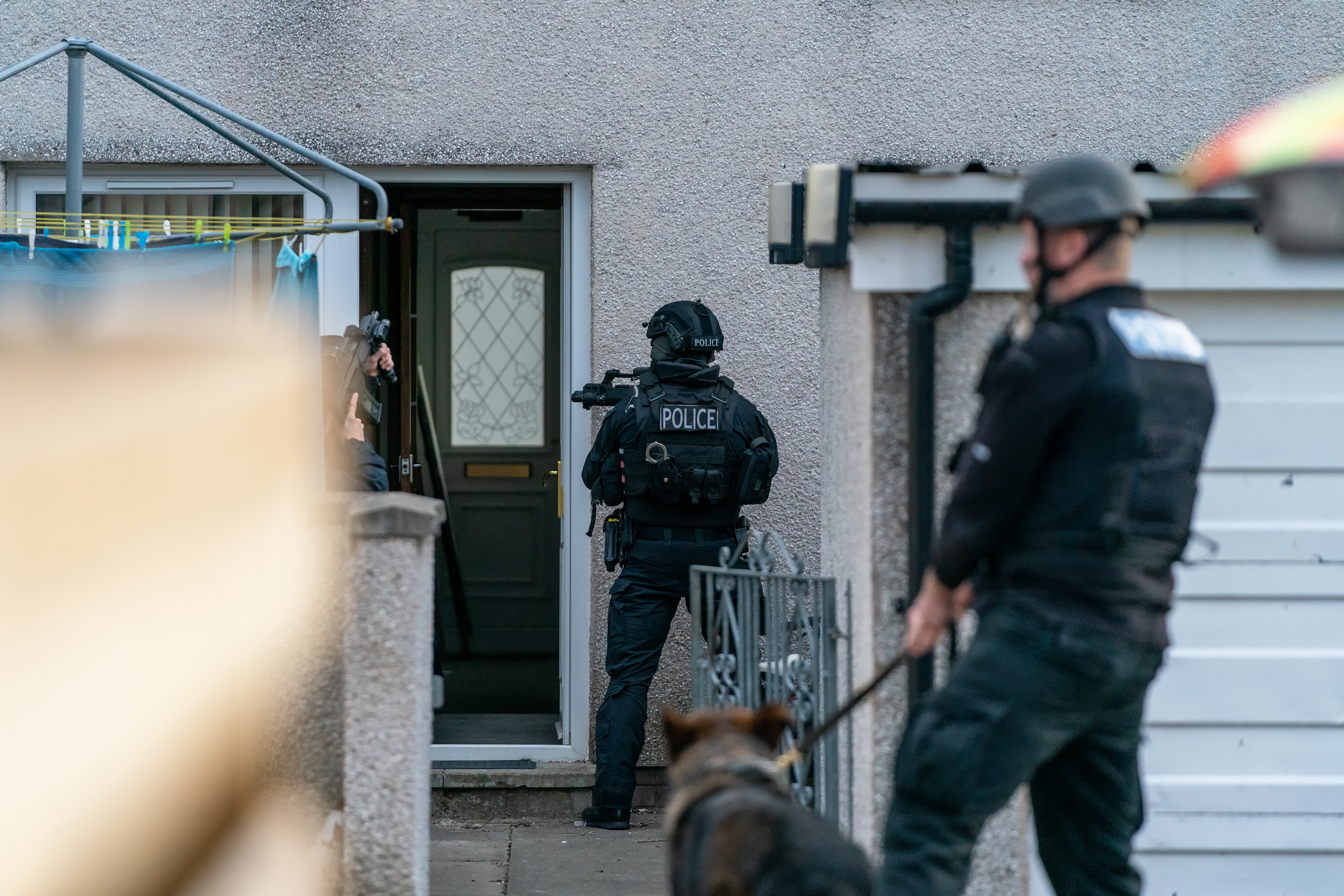 Police officers conducting a raid on a house | Source: Shutterstock.com