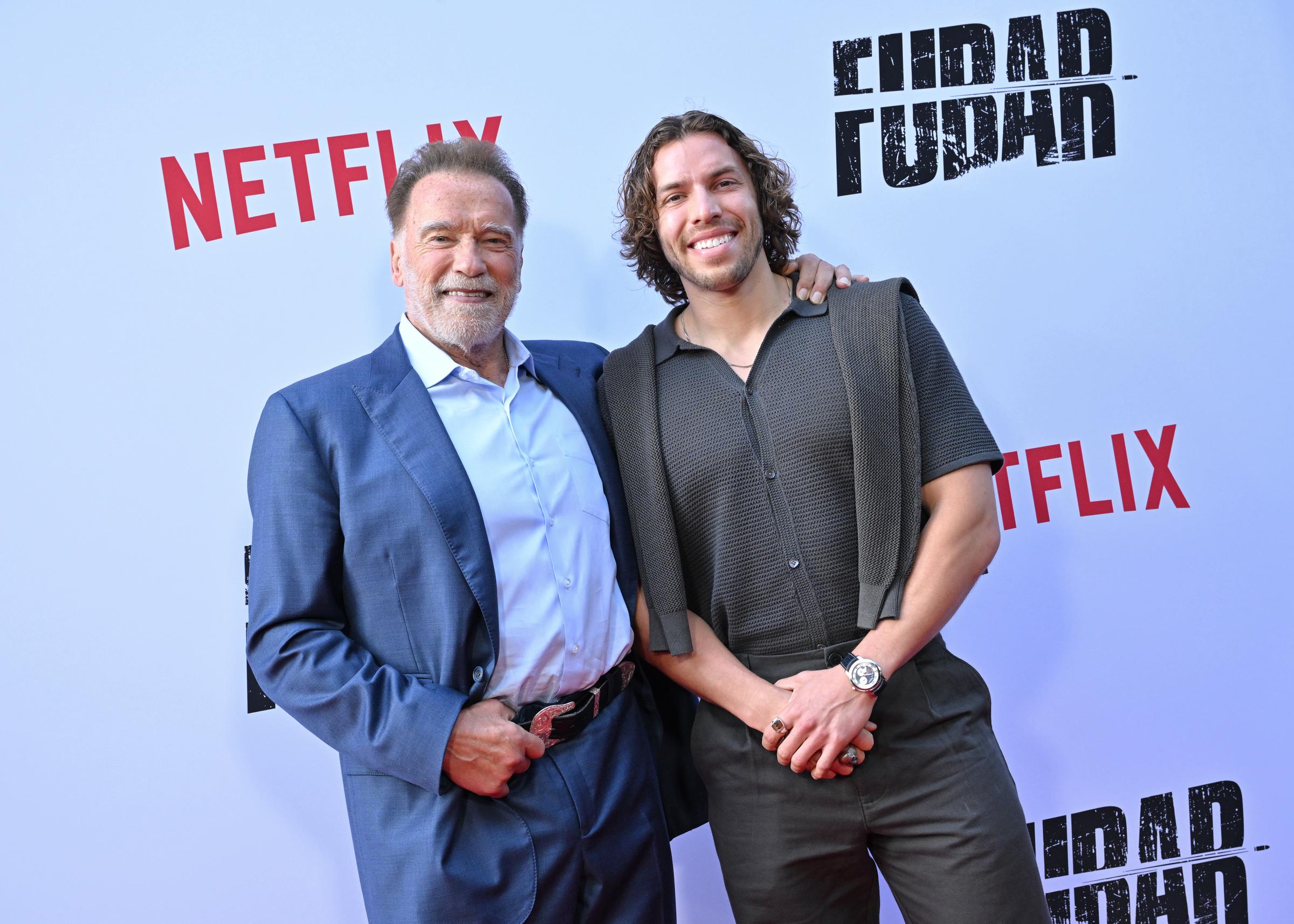 Arnold Schwarzenegger and Joseph Baena attend the premiere of "Fubar" Season 2 at Netflix Tudum Theater on June 11, 2025, in Los Angeles, California | Source: Getty Images