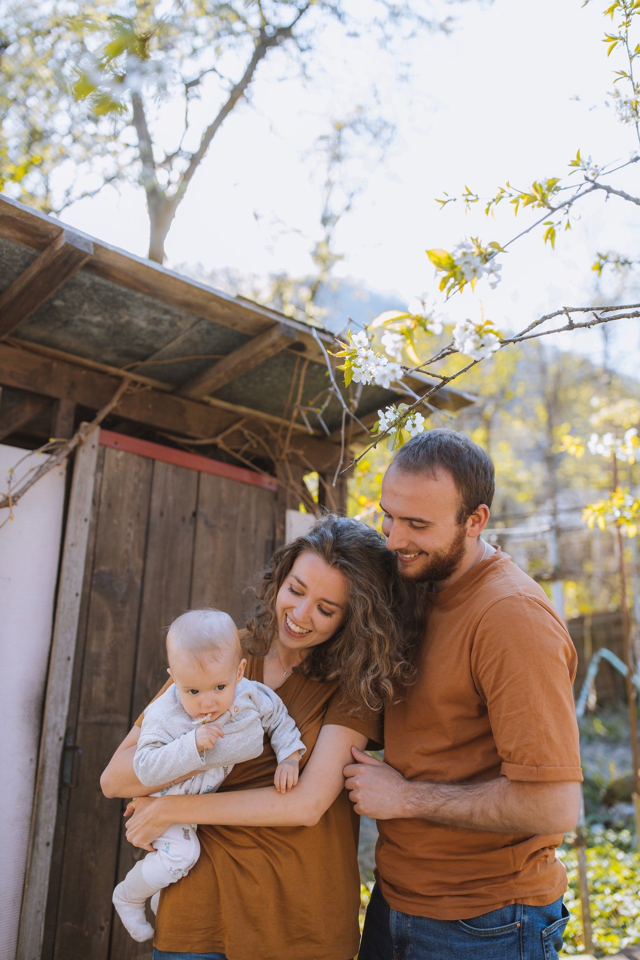 Happy parents with their infant child | Source: Pexels