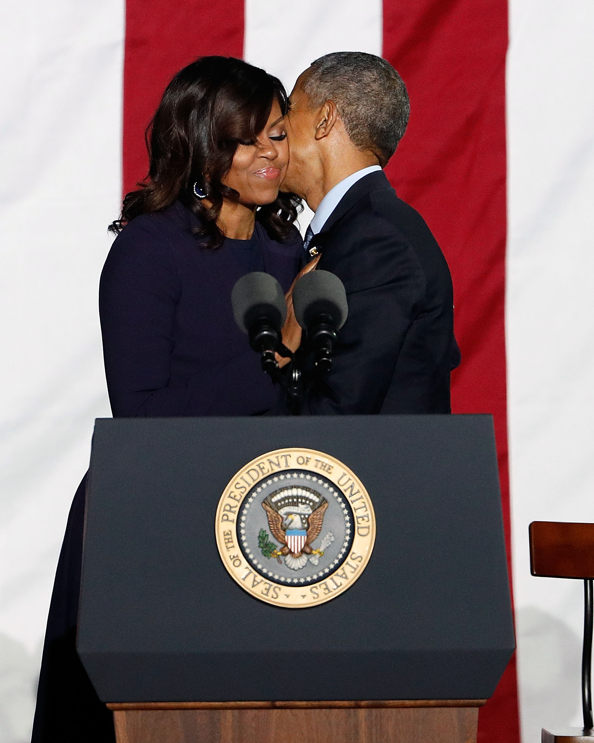 Michelle and Barack Obama embracing during "The Night Before" rally at Independence Hall on November 7, 2016, in Philadelphia, Pennsylvania. | Source: Getty Images