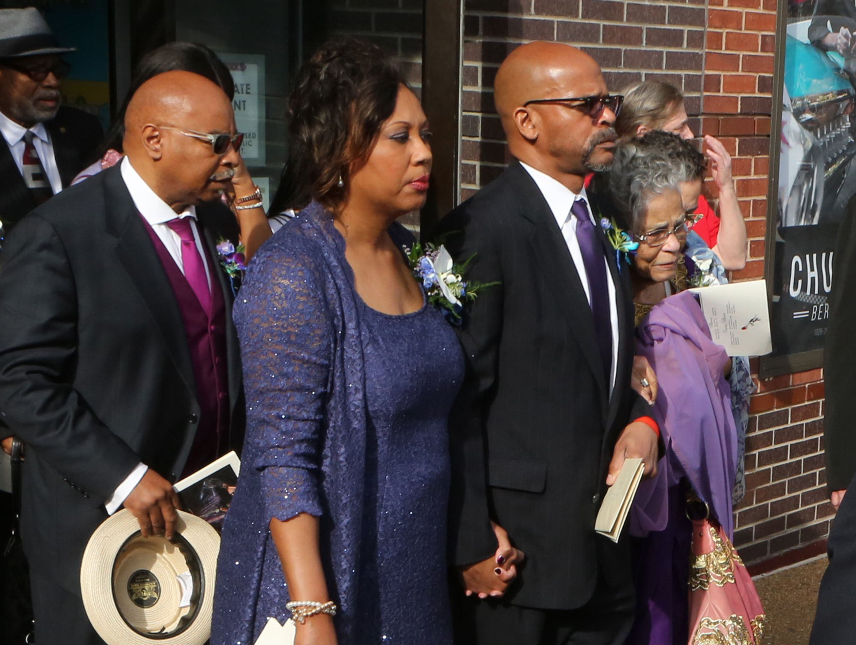 Charles Berry Jr. (right) with his wife and mother, Themetta Suggs (far right), leave The Pageant on Sunday, April 9, 2017 after the celebration of life for Chuck Berry in St. Louis, Missouri. | Source: Getty Images