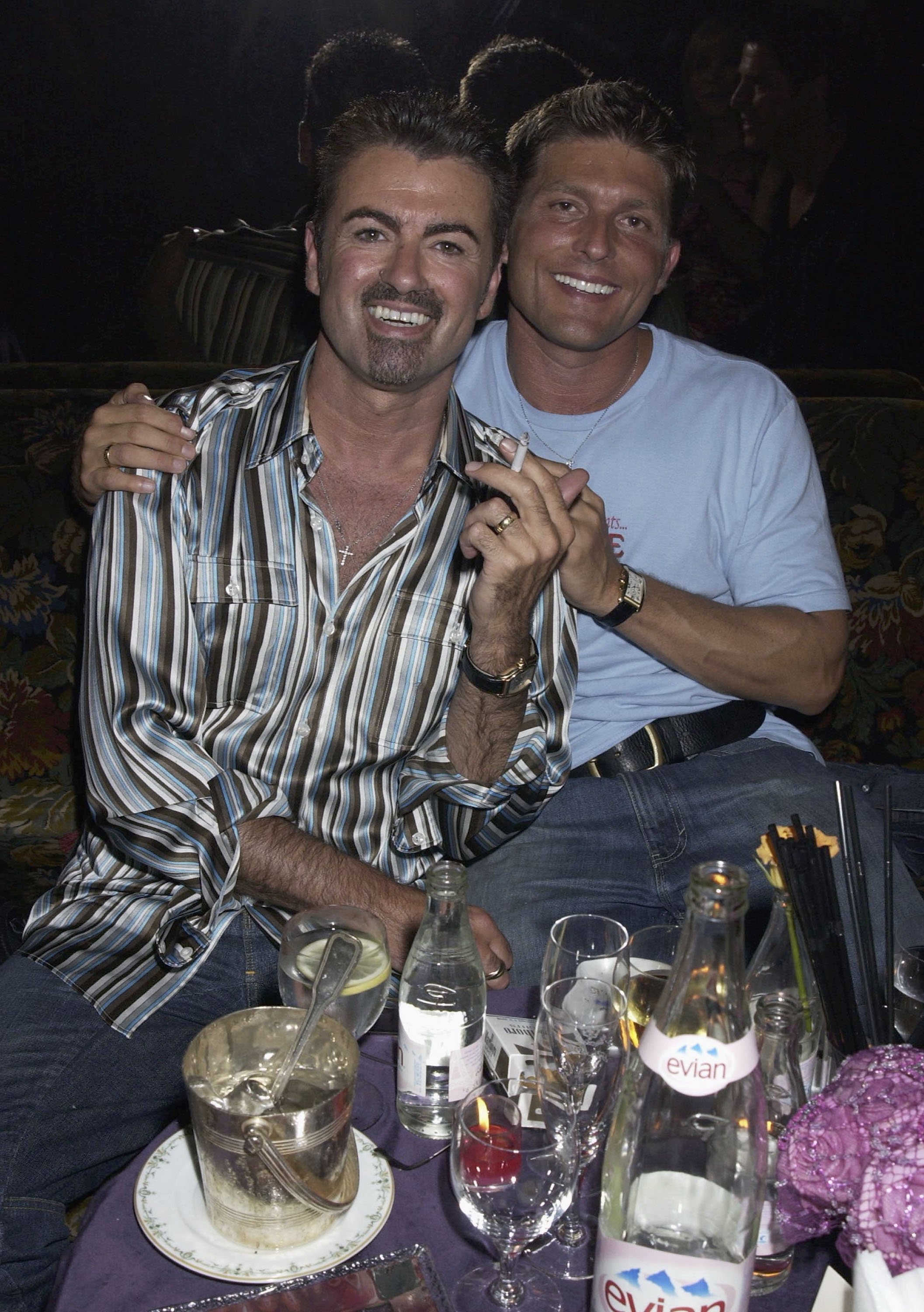 George Michael and Kenny Goss attending the Versace Couture Launch Party at The Ritz Hotel on 9th July 2002, in Paris. | Source: Getty Images