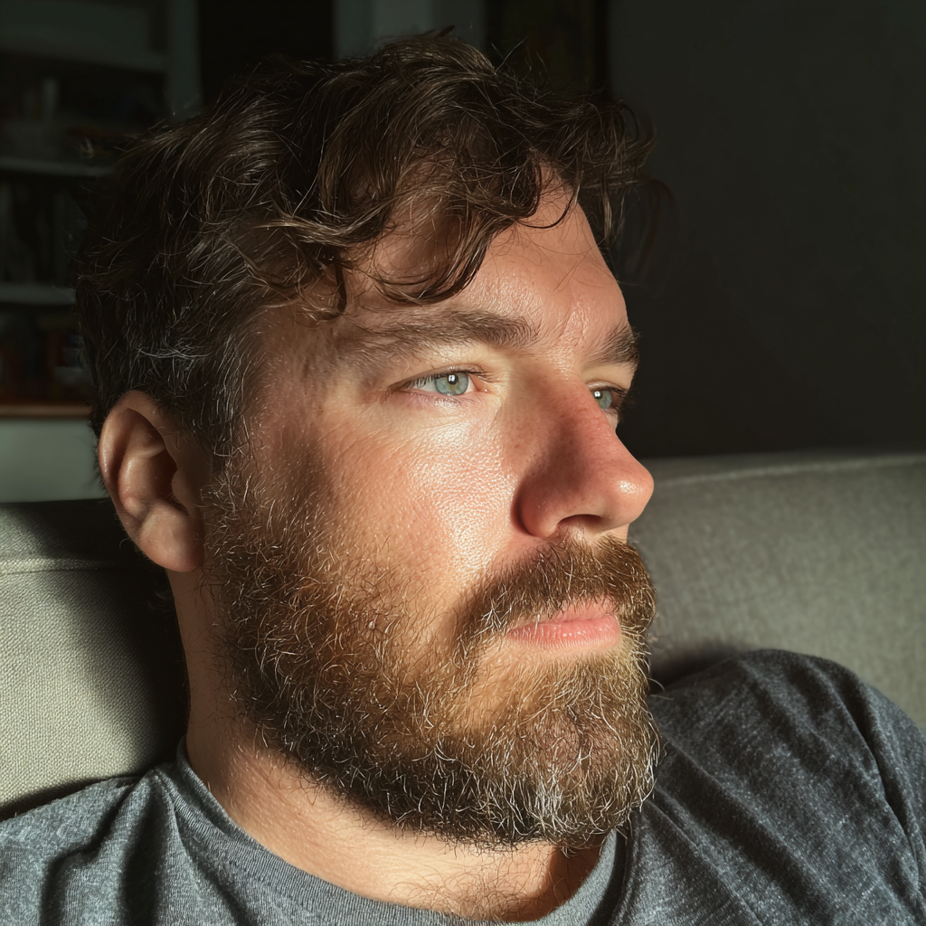 A man sitting on a couch | Source: Midjourney