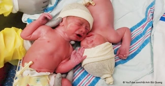 Newborn twins force nurse to put them back together again with heartbreaking cries