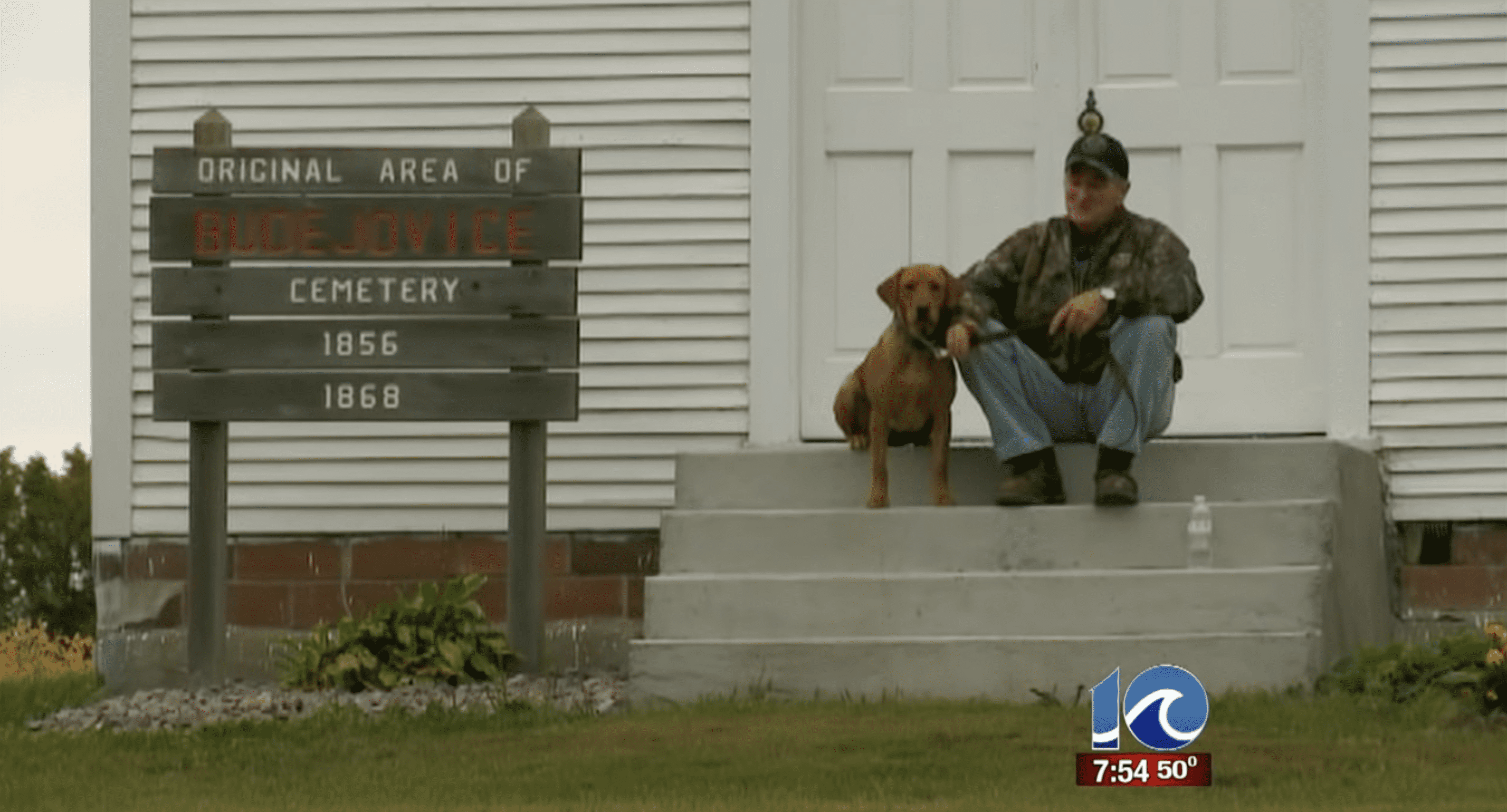 Thomas pictured sitting on the chapel's steps with his dog. | Source: YouTube.com/WAVY TV 10