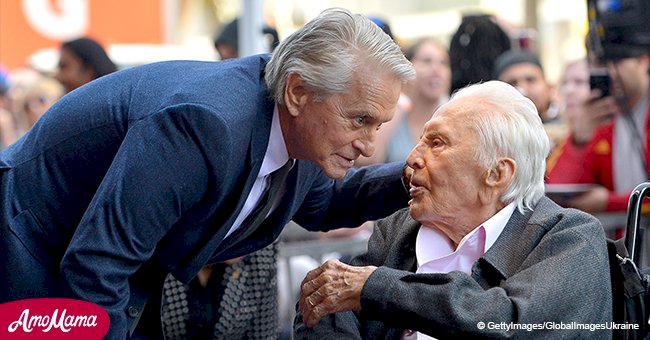 Michael Douglas kisses proud father Kirk at his Walk of Fame star ceremony