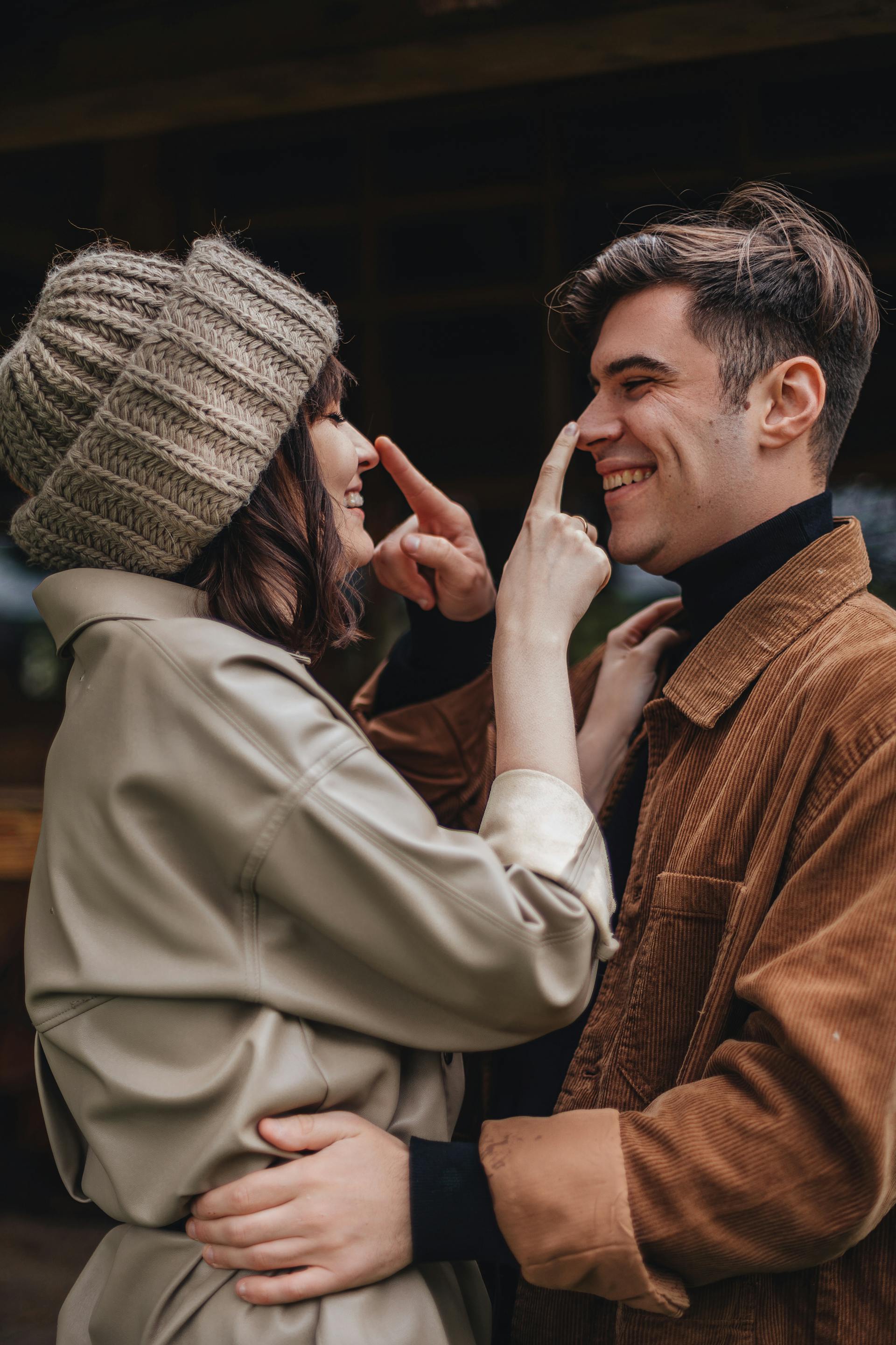 A couple laughing while stroking each other's noses | Source: Pexels
