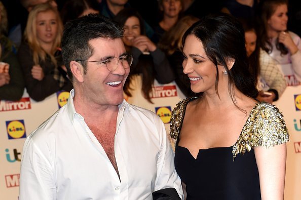 Simon Cowell and Lauren Silverman attend the Pride of Britain awards at The Grosvenor House Hotel on October 6, 2014, in London, England | Photo: Getty Images.