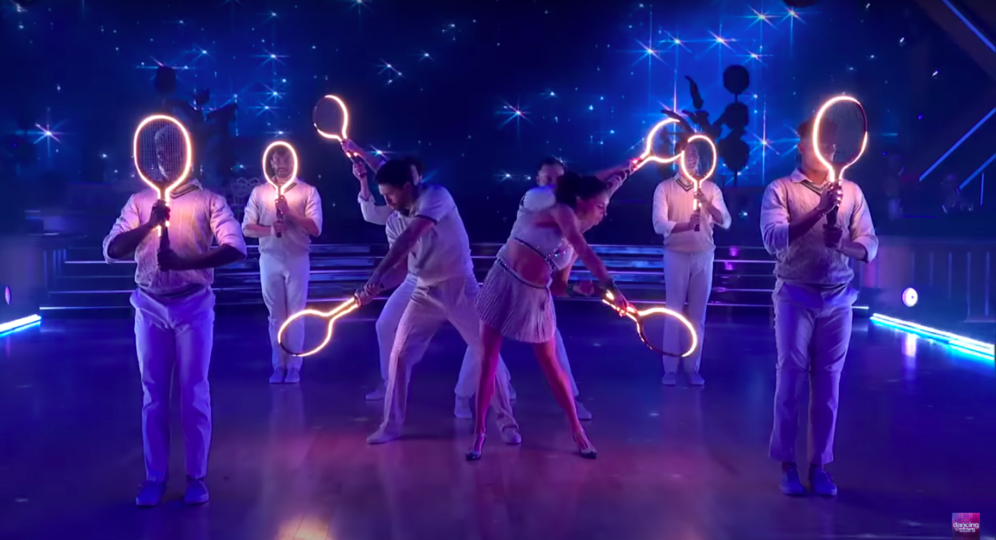 Joey Graziadei and Jenna Johnson dancing with backup dancers. | Source: YouTube/Dancing With The Stars