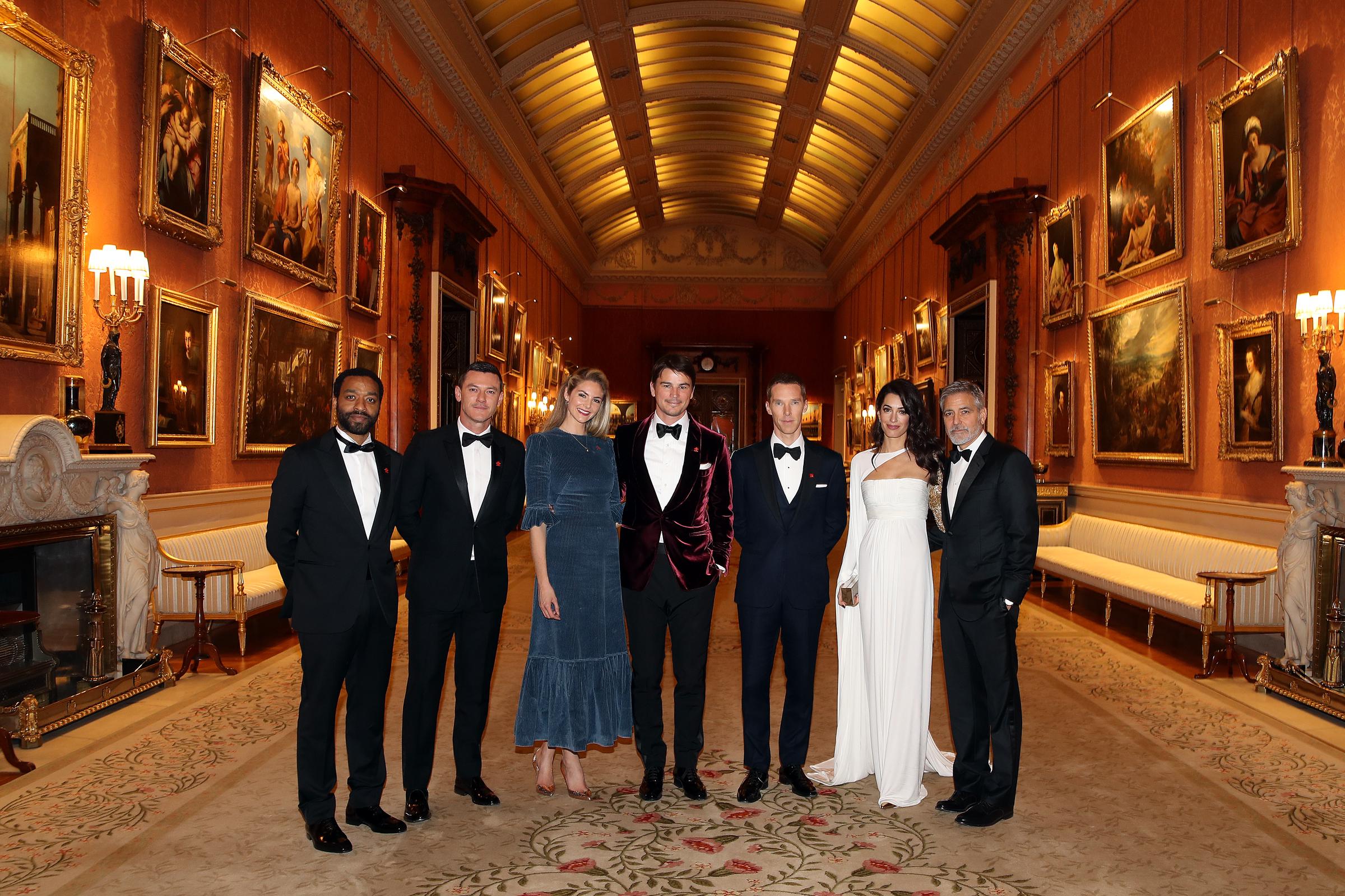 Chiwetel Ejiofor, Luke Evans, Tamsin Egerton, Josh Hartnett, Benedict Cumberbatch, Amal, and George Clooney attend a dinner to celebrate The Prince's Trust, hosted by Prince Charles, Prince of Wales at Buckingham Palace on March 12, 2019 in London, England | Source: Getty Images