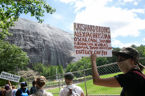 Black Lives Matter protesters march towards the Confederate carving in Stone Mountain Park on June 16, 2020 in Stone Mountain, Georgia. | Photo: Getty Images