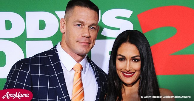 Nikki Bella is seen gazing into her beau’s eyes while wearing a skintight mini-dress