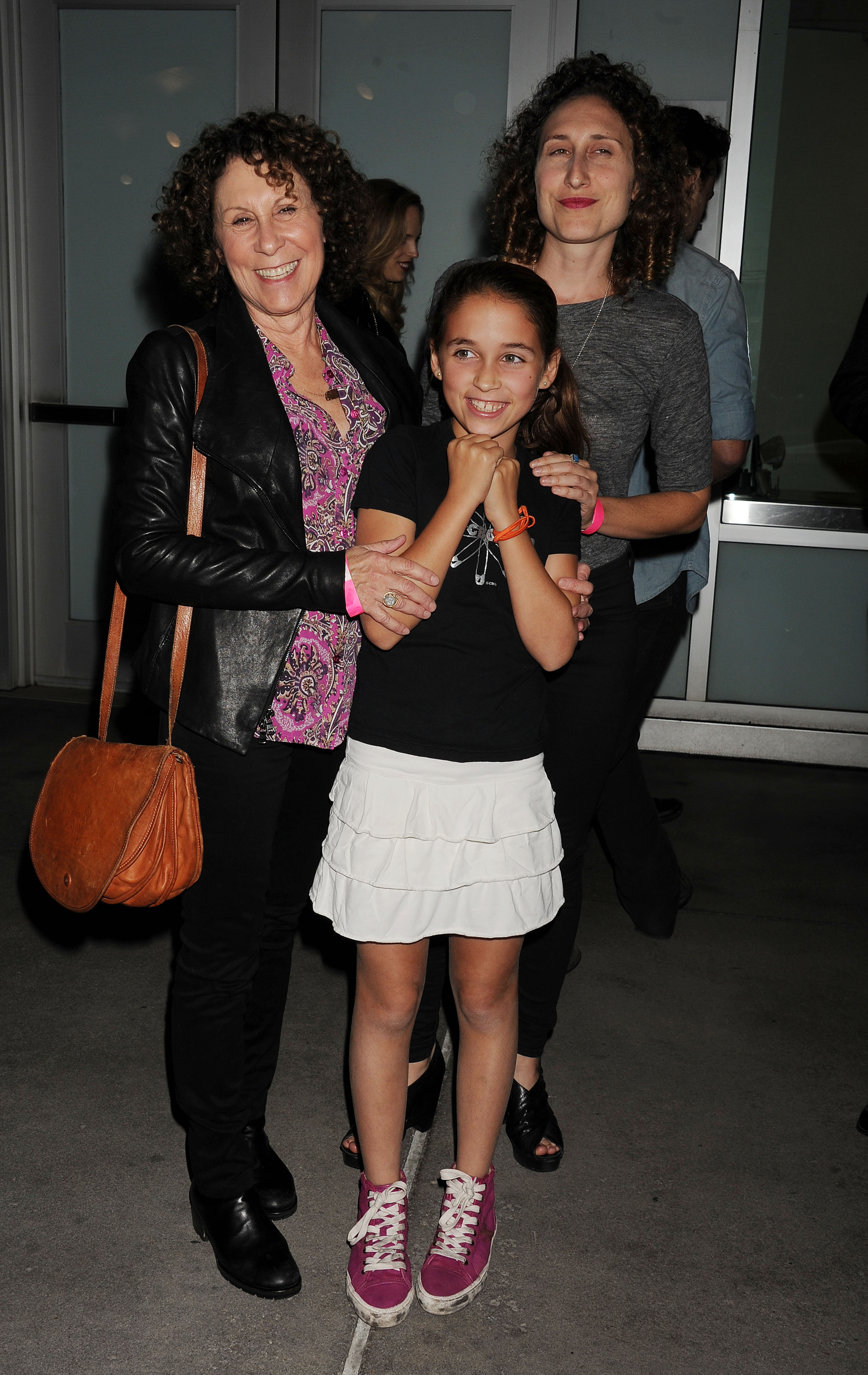 Actress Rhea Perlman (Left), granddaughter (Middle), and daughter Grace Fan DeVito (Right) at the "CBGB" Special Screening at ArcLight Cinemas in Hollywood, California on October 1, 2013 | Source: Getty Images