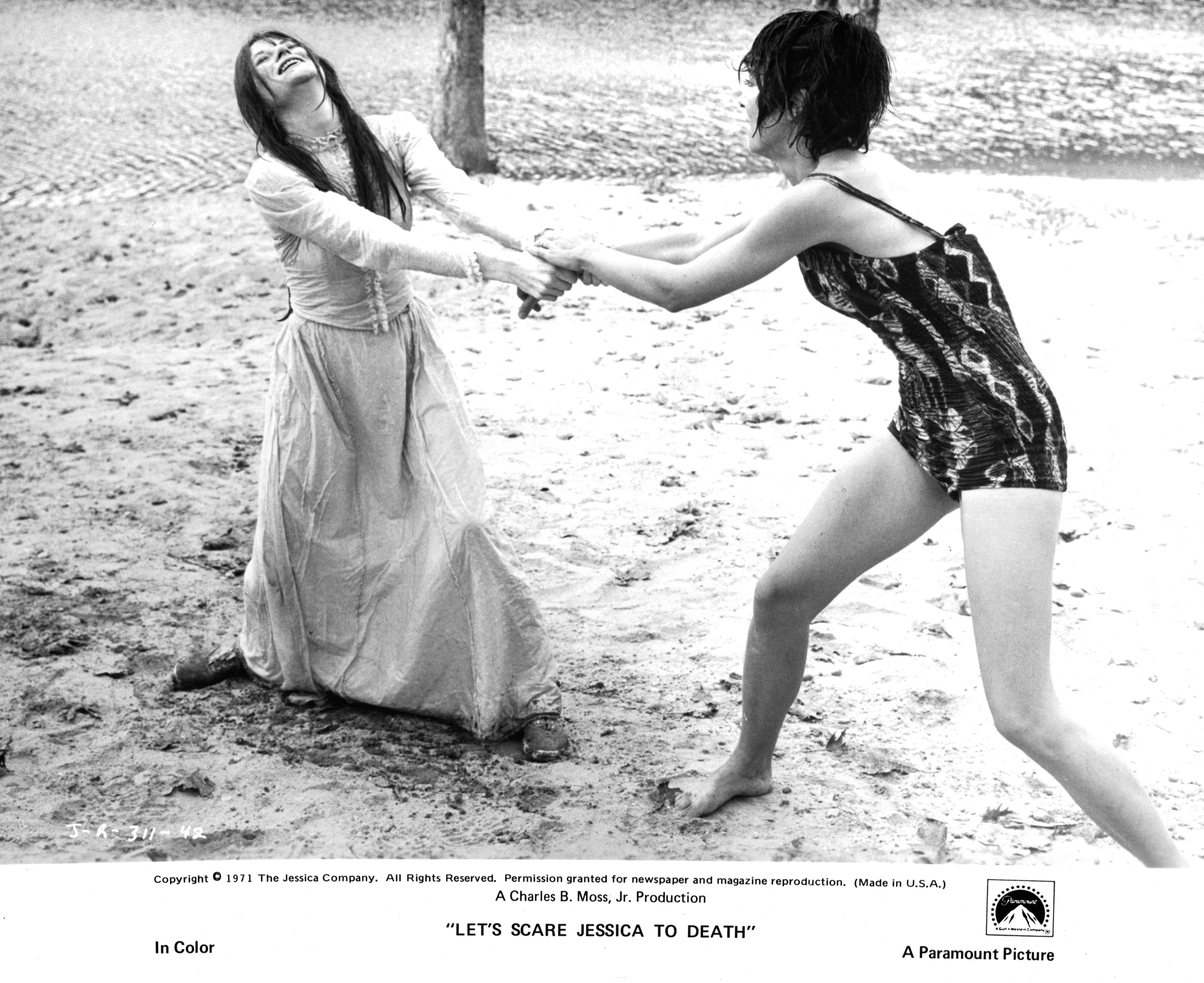 Mariclare Costello and Zohra Lampert are tugging at one an other in the sand in a scene from the film 'Let's Scare Jessica To Death', 1971 | Source: Getty Images