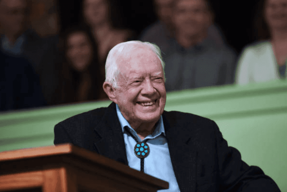 Former U.S. President Jimmy Carter sits in front of a pulpit as he speaks to the congregation at Maranatha Baptist Church during Sunday school, on April 28, 2019, in Plains, Georgia | Source: Paul Hennessy/NurPhoto via Getty Images