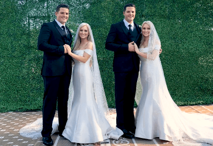 Joshua and Jeremy Salyers getting married to Brittany and Briana Deane in a ceremony that took place at the 2018 Twins Days Festival in Twinsburg | Photo: Youtube/Yahoo Life