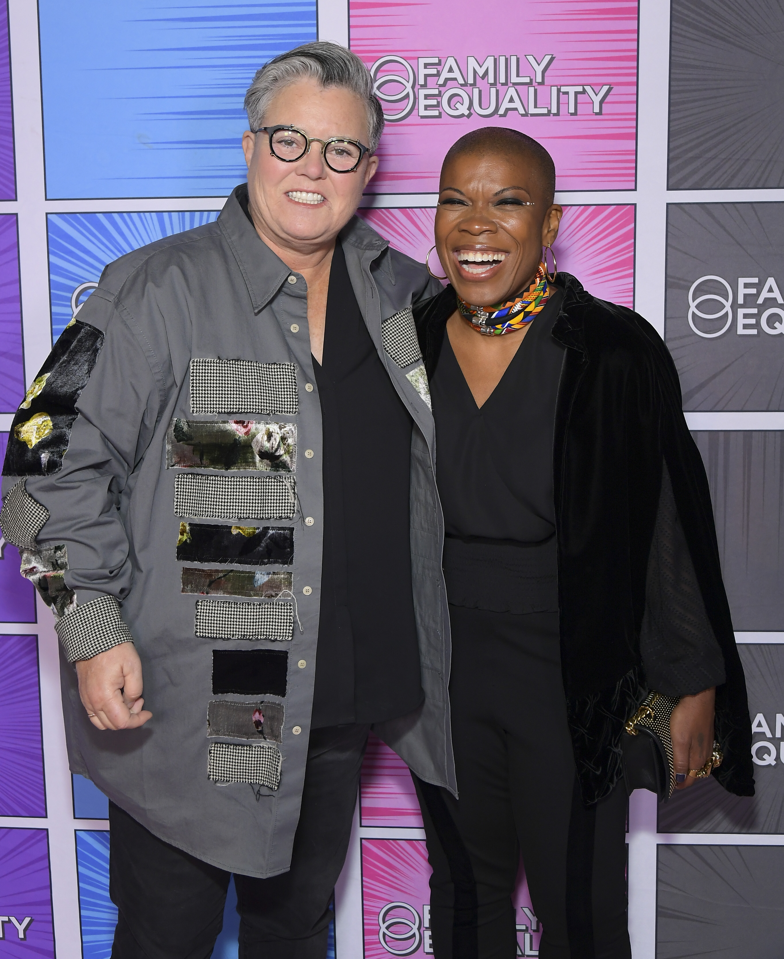 At "LA Impact: A Night of Heroes" on October 15, 2022, Rosie O'Donnell beams beside Family Equality CEO Stacey Stevenson. Her wide smile, relaxed shoulders, and playful energy radiate warmth, making her presence feel approachable and joyful.