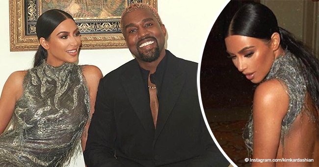 Kim Kardashian stuns the crowd in backless Versace dress on date night with Kanye