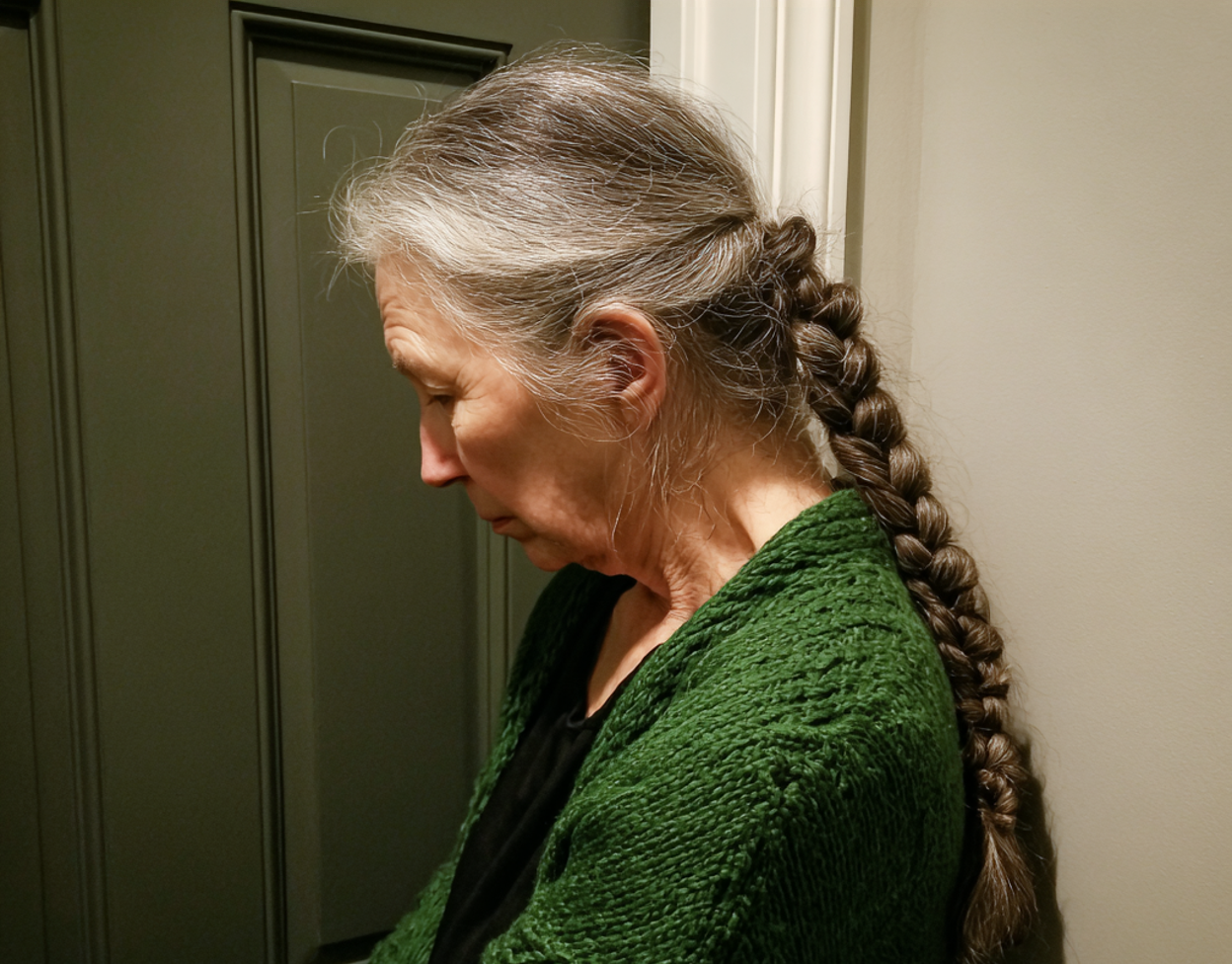 A woman standing in front of a closed door | Source: Midjourney