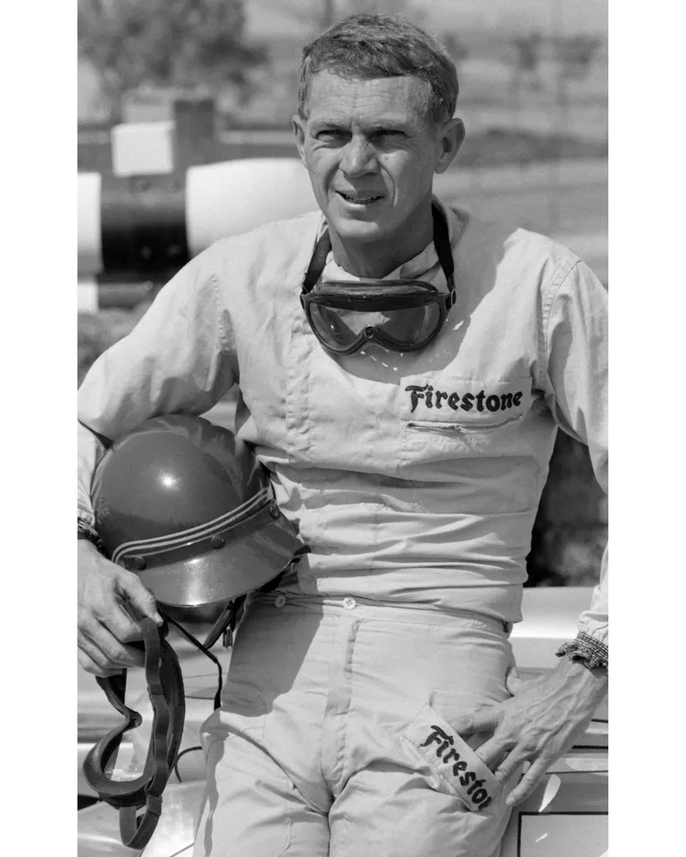 American actor Steve McQueen (1930 - 1980), in Firestone racing suit, at Riverside Raceway, Riverside, California, July 1966. | Source: Getty Images
