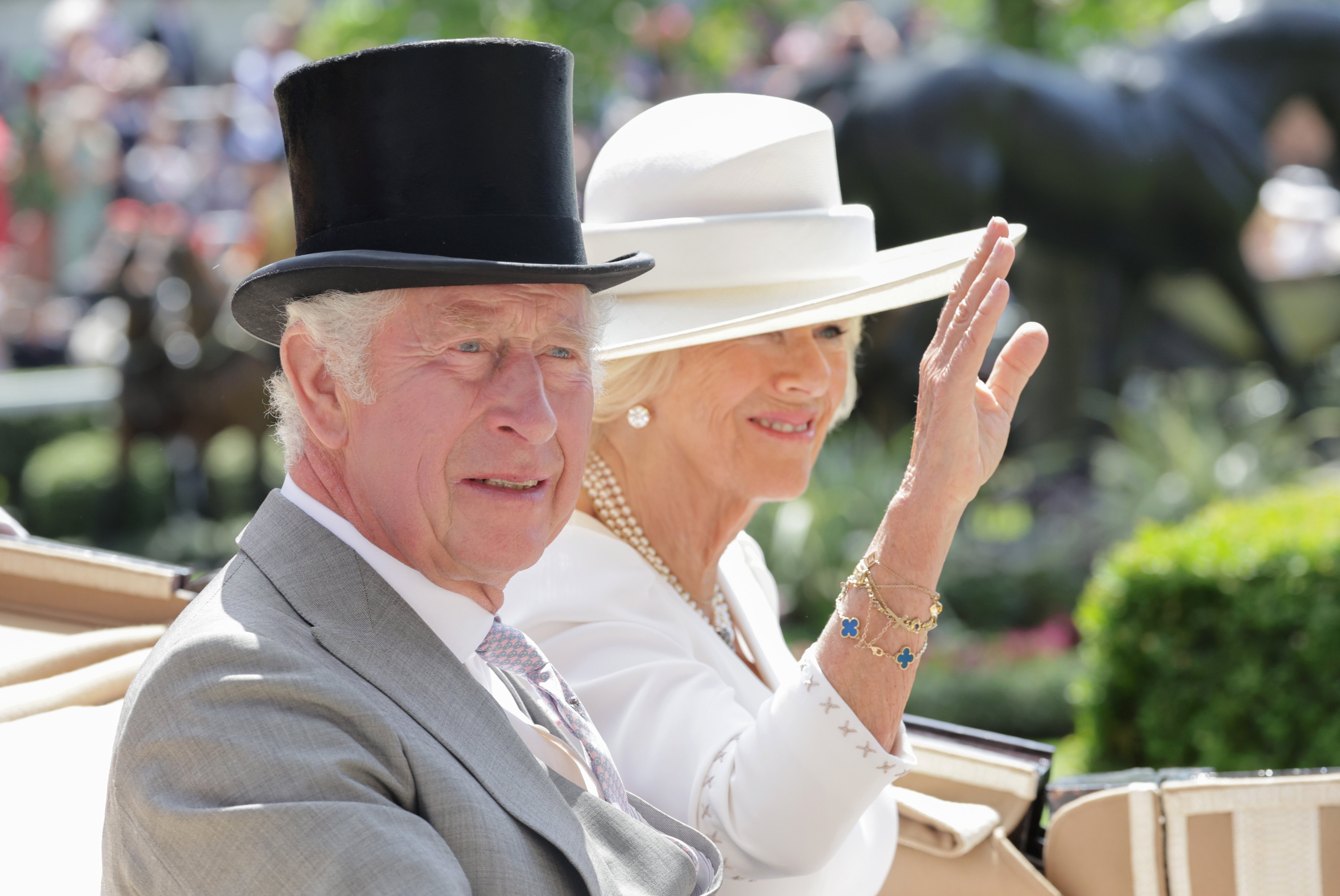 Camilla, Duchess of Cornwall pictured waving as she and Prince Charles arrive into the parade ring on the royal carriage as they attend Royal Ascot 2022 at Ascot Racecourse on June 15, 2022 in Ascot, England. | Source: Getty Images