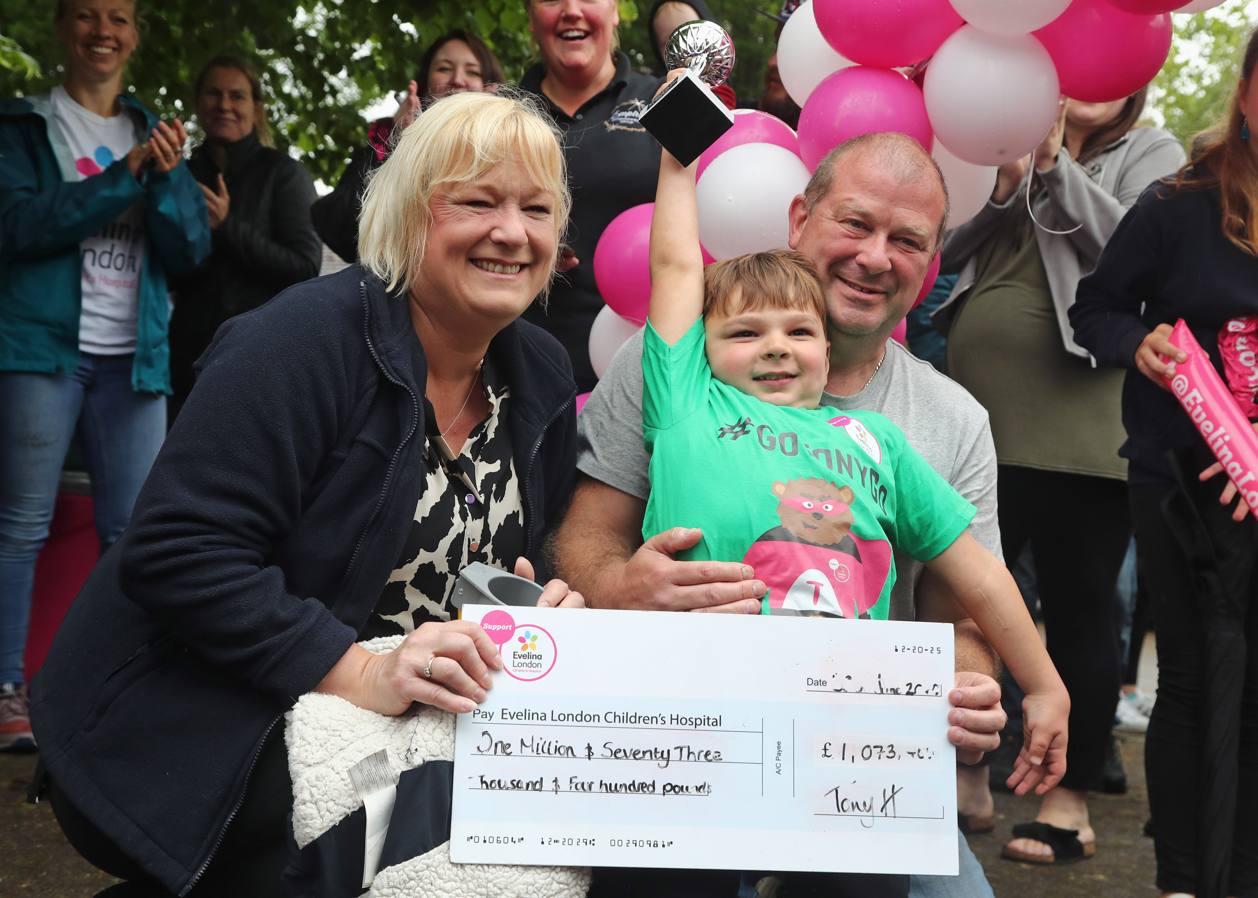 Tony Hudgell celebrates with his parents, Paula and Mark Hudgell, after taking the final steps in his fundraising walk on 30 June 2020 in Kent, England. | Source: Getty Images