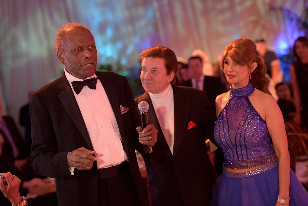 Sidney Poitier, singer Bobby Sherman, and Brigitte Sherman attend the Brigitte and Bobby Sherman Children's Foundation's 6th Annual Christmas Gala | Getty Images