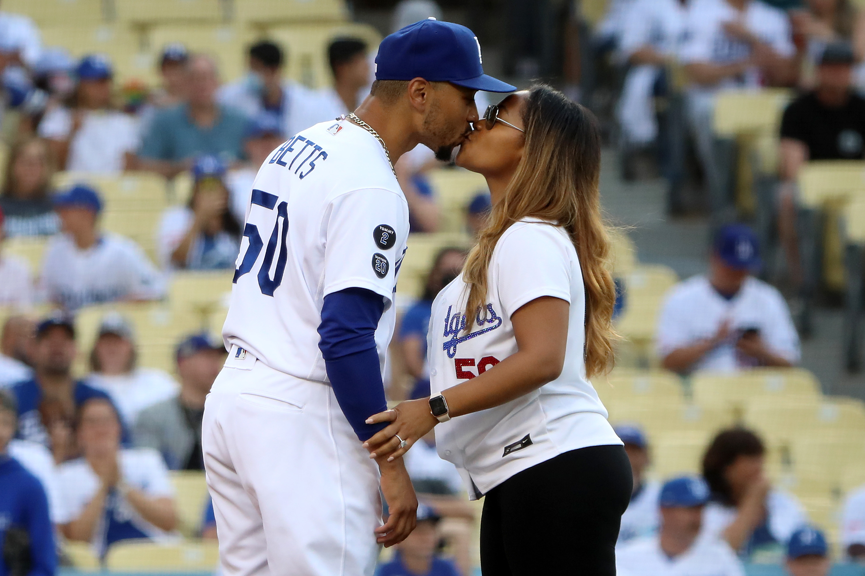 Mookie Betts and Brianna Hammonds kissing before the game at Dodger Stadium on June 16, 2021, in Los Angeles | Source: Getty Images