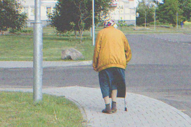 Older lady walking on the street | Source: Shutterstock