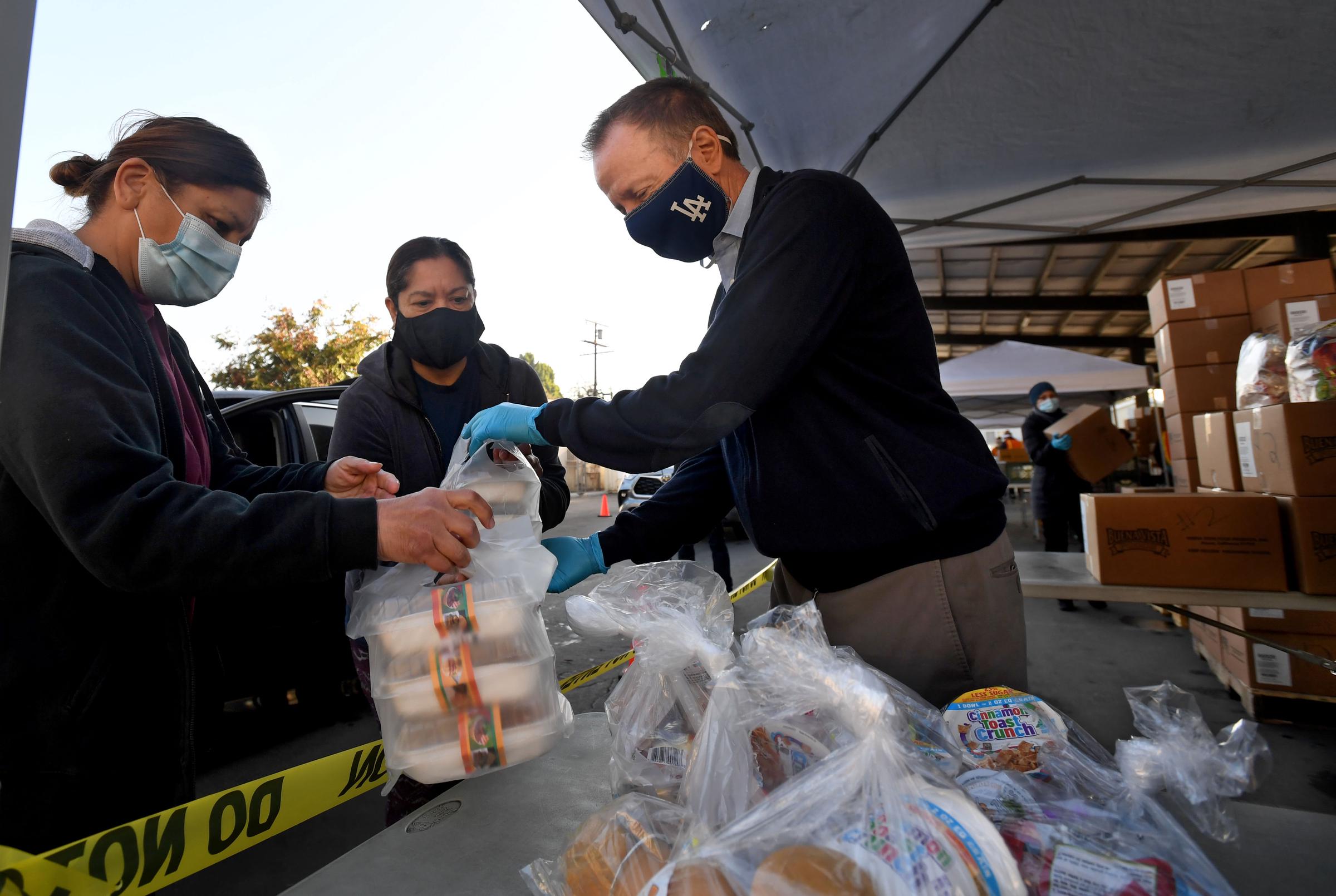 Austin Beutner helps distribute meals to needy families at South Gate High School on November 25, 2020, in South Gate, California | Source: Getty Images
