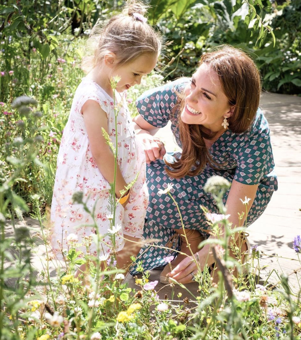 All smiles: Kate beams at a little girl in pink dress at her Back To Nature Garden. | Source: Instagram/kensigtonroyal