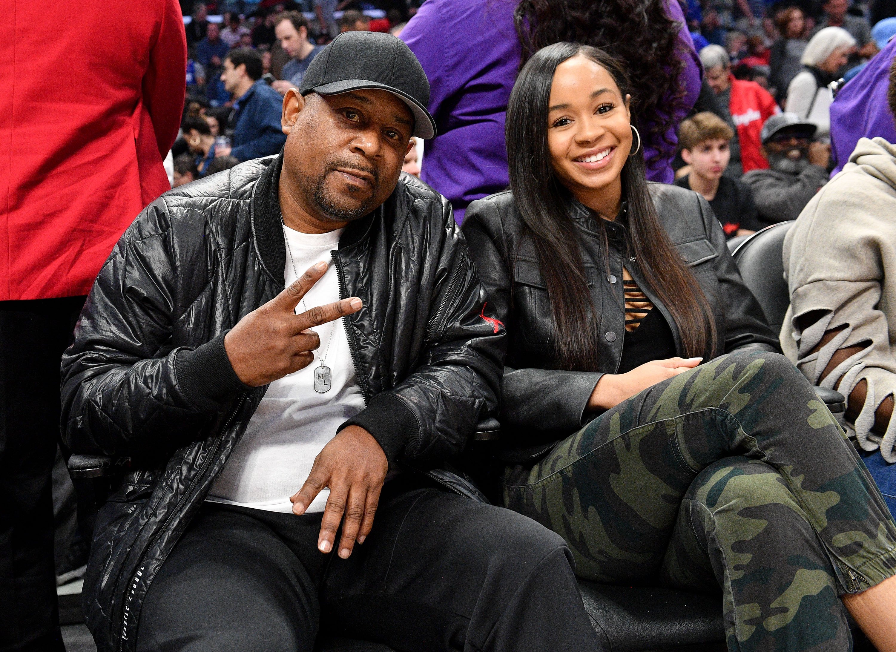 Martin Lawrence and Jasmine Page Lawrence pose at a basketball game between the Los Angeles Clippers and the Philadelphia 76ers at Staples Center on March 1, 2020, in Los Angeles, California | Source: Getty Images