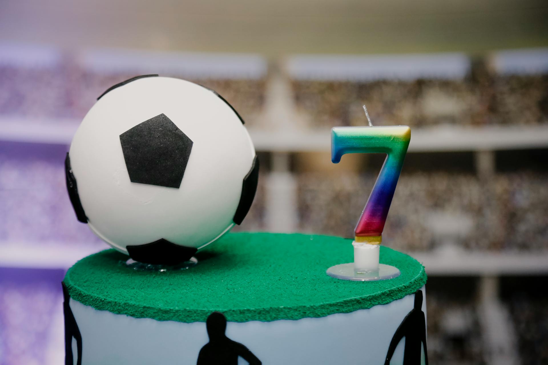 A 7th birthday cake with a soccer ball on top | Source: Pexels