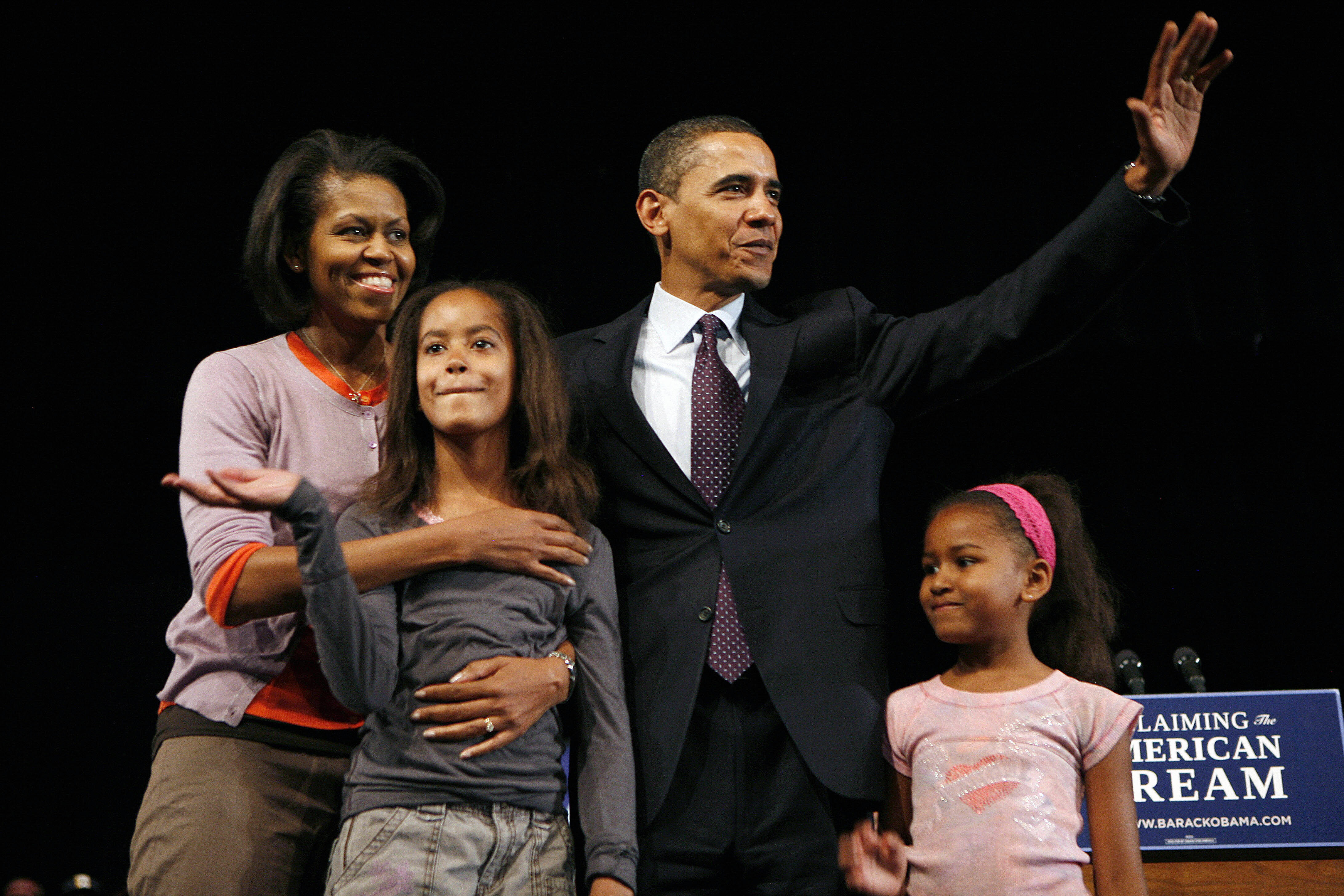 The daughters of the former president faced public comparison to their famous parents from the very beginning of the historic campaign. In this photo, the then-presidential candidate Barack Obama, his wife Michelle, and daughters Malia and Sasha Obama stood together after a campaign speech at Lawrence North High School on May 3, 2008, in Indianapolis, Indiana. | Source: Getty Images