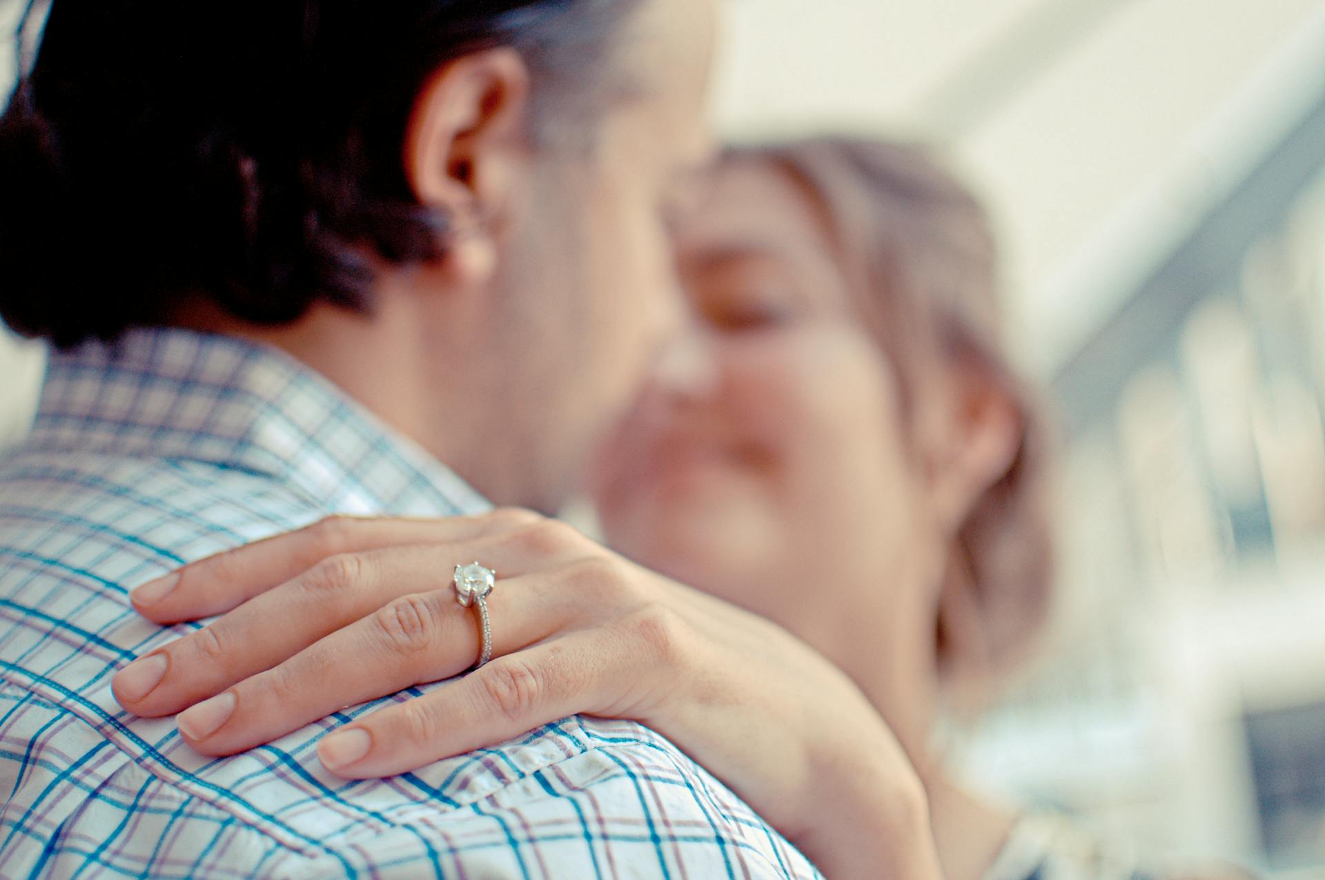 A shallow focus photo of a man and woman hugging | Source: Pexels