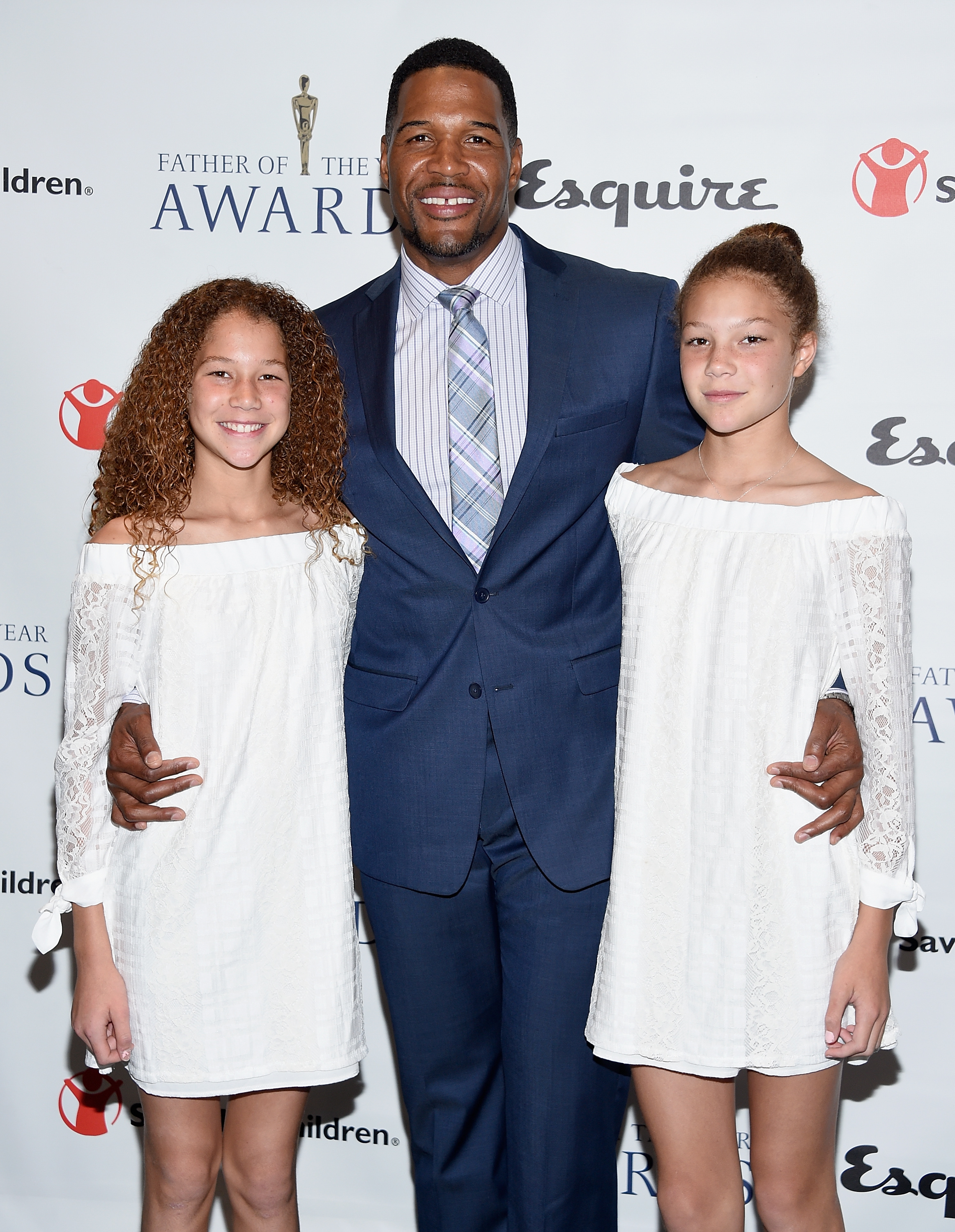 Michael Strahan and his daughters Isabella and Sophia Strahan at The 76th Annual Father of The Year Awards on June 15, 2017, in New York City | Source: Getty Images