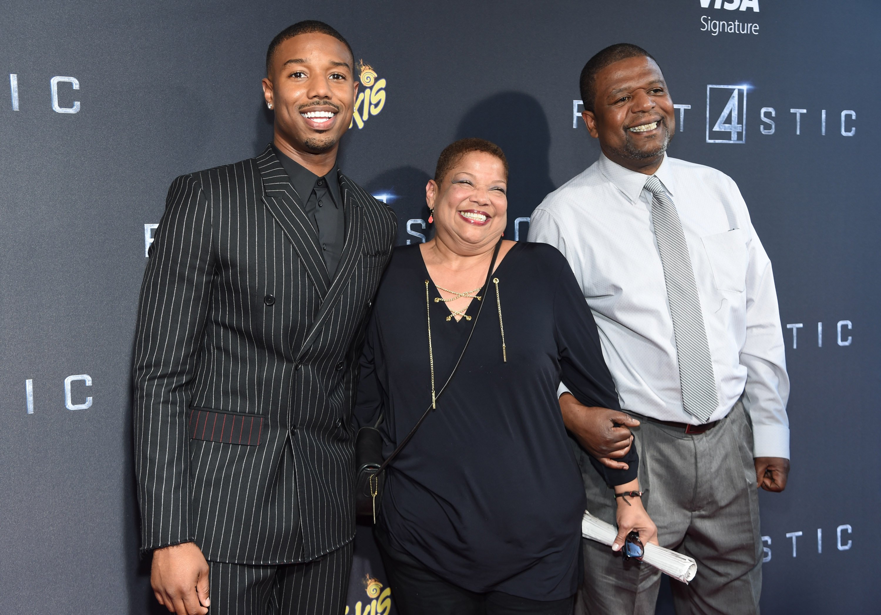 Michael B. Jordan posing with his parents Donna and Michael B. Jordan at the New York premiere of "Fantastic Four" at Williamsburg Cinemas on August 4, 2015 in New York City. | Source: Getty Images