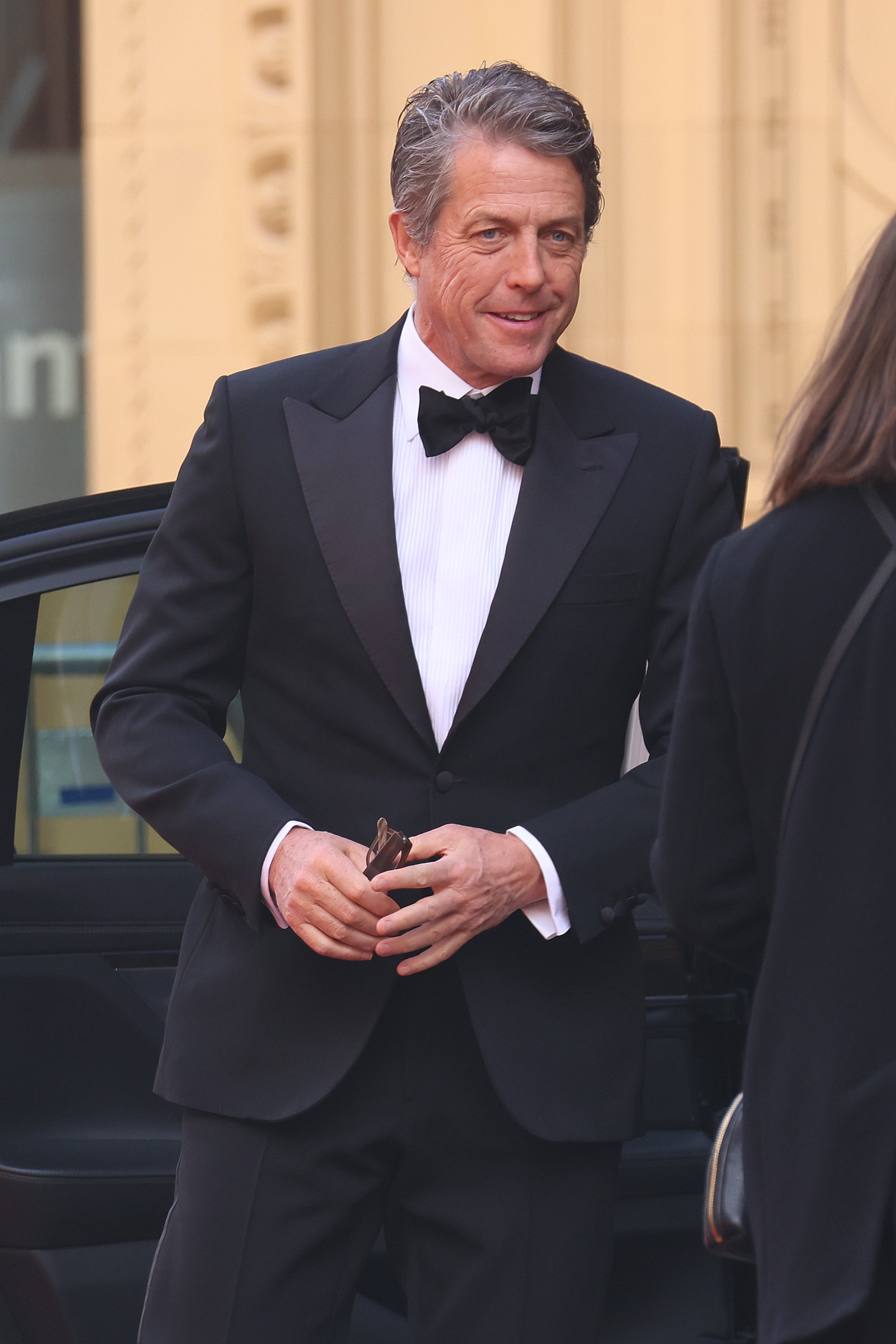  Awards Presenter Hugh Grant seen arriving at the EE British Academy Film Awards 2021 at the Royal Albert Hall on April 11, 2021 in London, England. | Source: Getty Images 