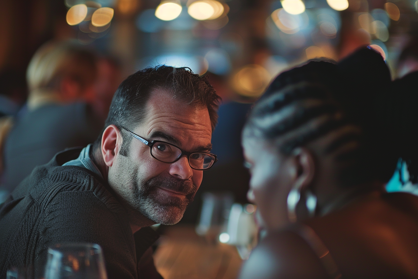 A man at a restaurant leaning close to a woman | Source: Midjourney