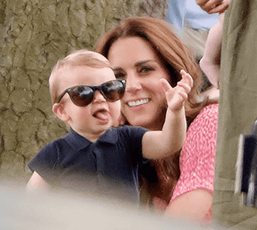 Prince Louis and Kate Middleton sit next to a tree as they watch the King Power Royal Charity Polo Match, on July 10, 2019, in Wokingham, England | Source: Max Mumby/Indigo/Getty Images