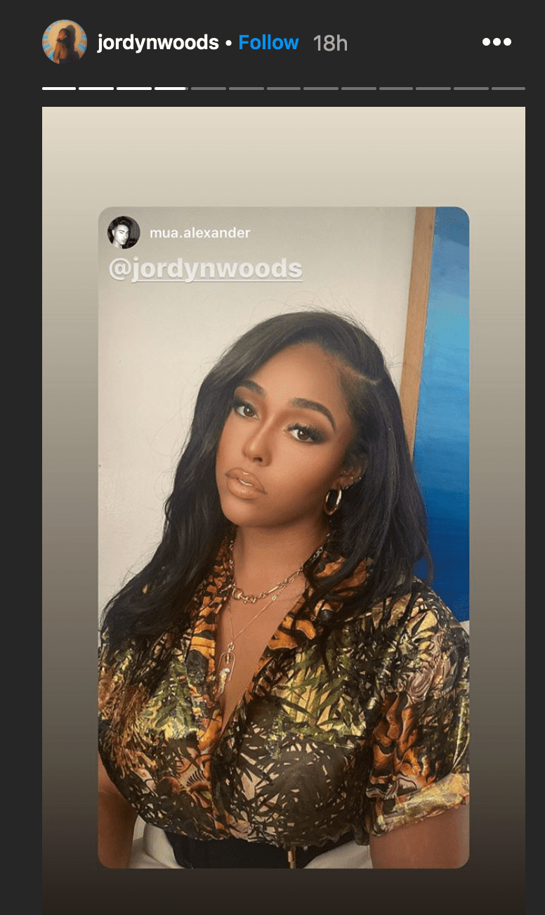 Jordyn Woods poses in a chair while wearing a jungle print outift | Source: Instagram.com/jordynwoods