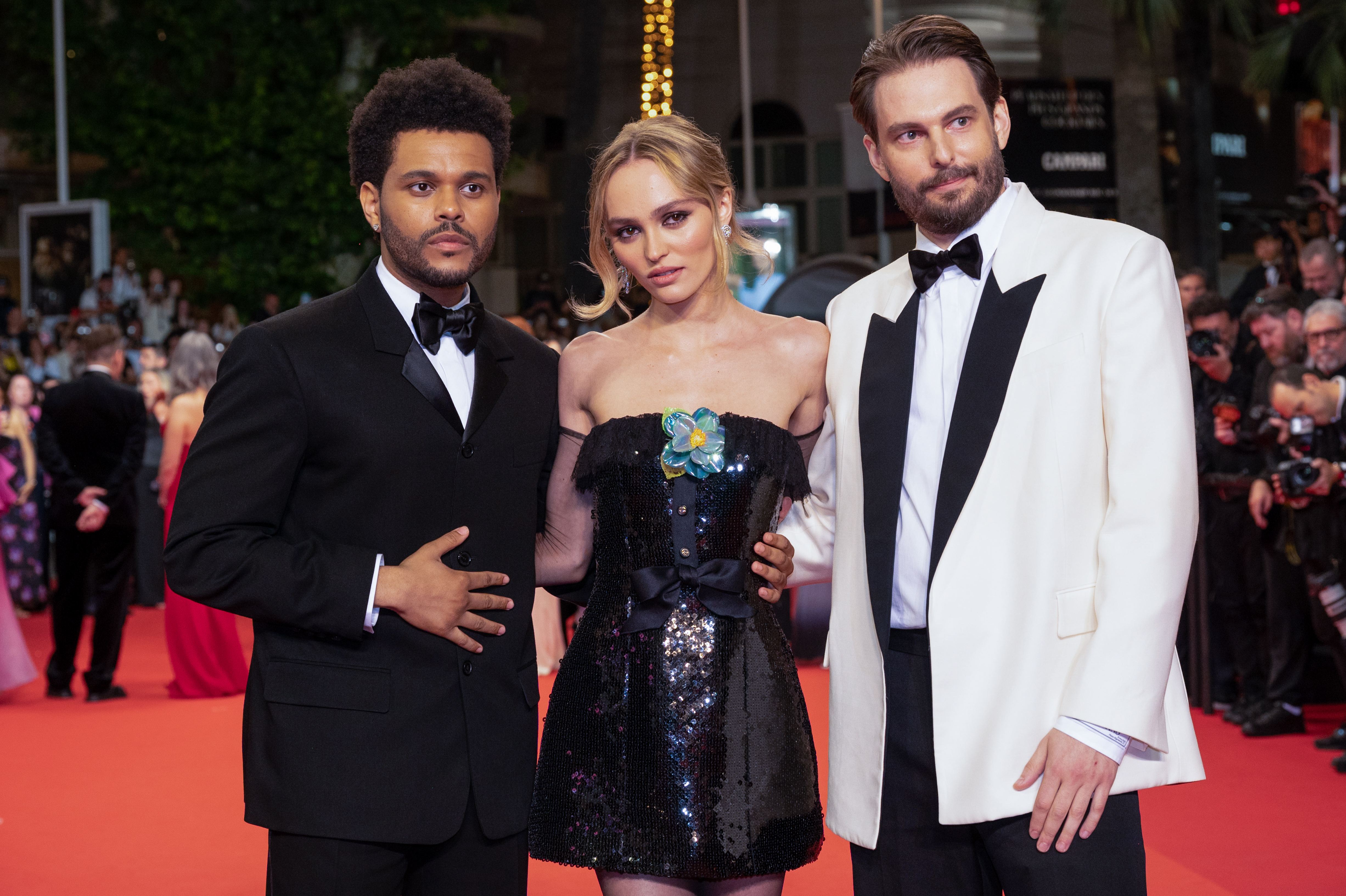 Lily-Rose Depp, Abel “The Weeknd” Tesfaye, and Sam Levinson at the "The Idol" red carpet in Cannes, France on May 22, 2023 | Source: Getty Images