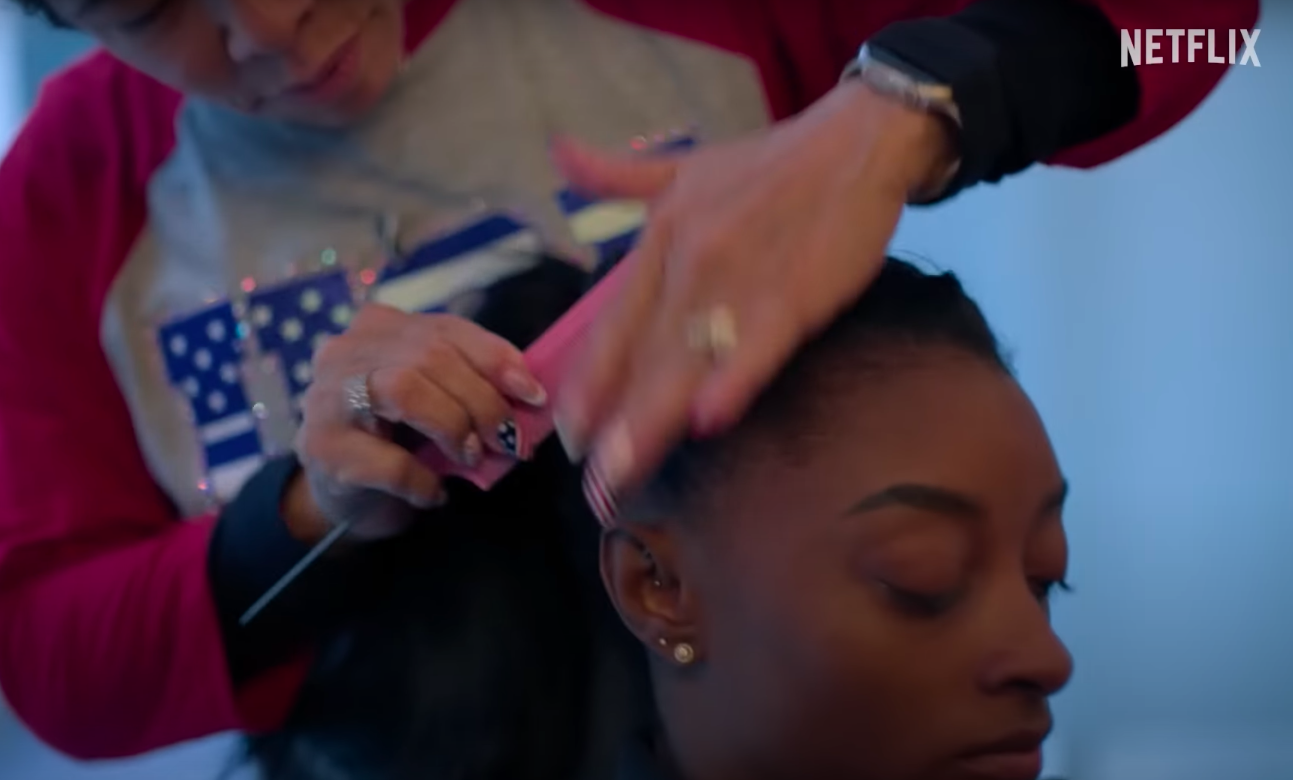 Nellie Biles doing Simone Biles' hair, posted on July 15, 2024 | Source: YouTube/Netflix