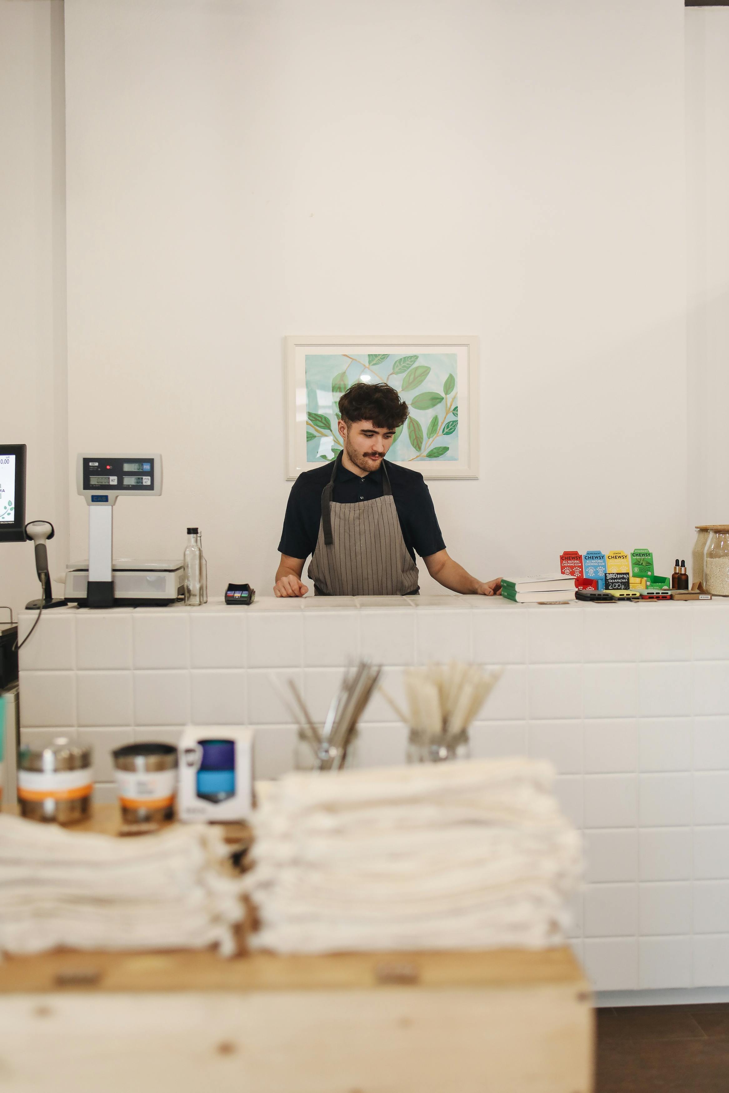 A cashier in a small shop | Source: Pexels