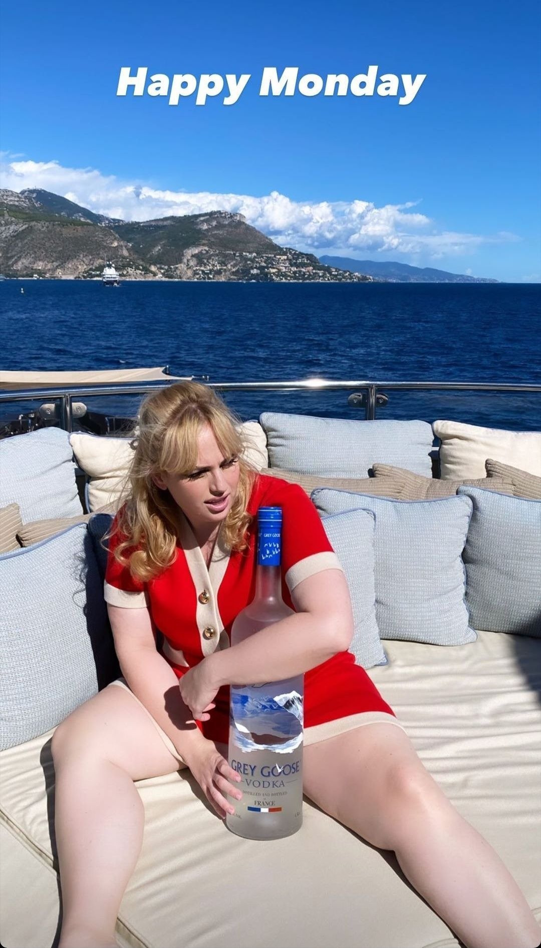 Rebel Wilson poses with a bottle of vodka on a yacht in Monaco in September 2020 | Photo: Instagram/ Rebel Wilson